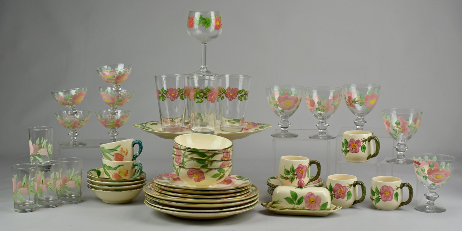 (40) Pcs Franciscan Dinnerware: (40) Pcs Franciscan dinnerware, Desert Rose & Tulip patterns, c/o 4 dinner plates 4 salad plates, 4 fruit bowls, 4+2 mugs, oval platter, covered butter, 4 tall tumblers, 4 juice glasses, 5 water goble