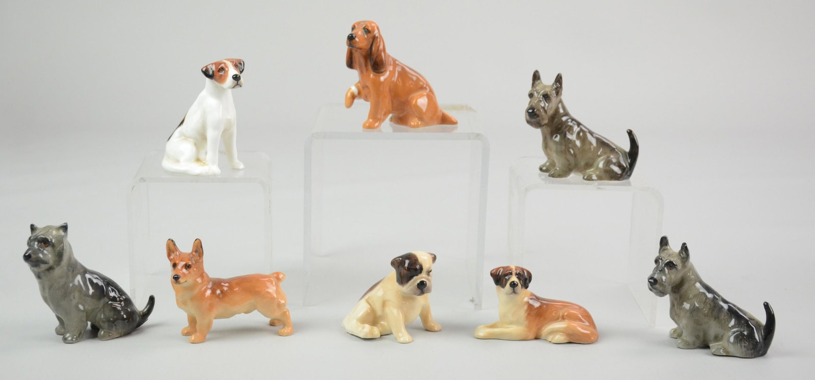 (8) Royal Doulton Dog Figures: (8) Royal Doulton Dog Figures Including: Bulldog Puppy K2, Foxhound K7, Seated Cairn Terrier K11, Welsh Corgi K16, Saint Bernard K19, Cocker Spaniel K9, (2) Scottish Terriers K18, (Tallest 2-1/2" h)