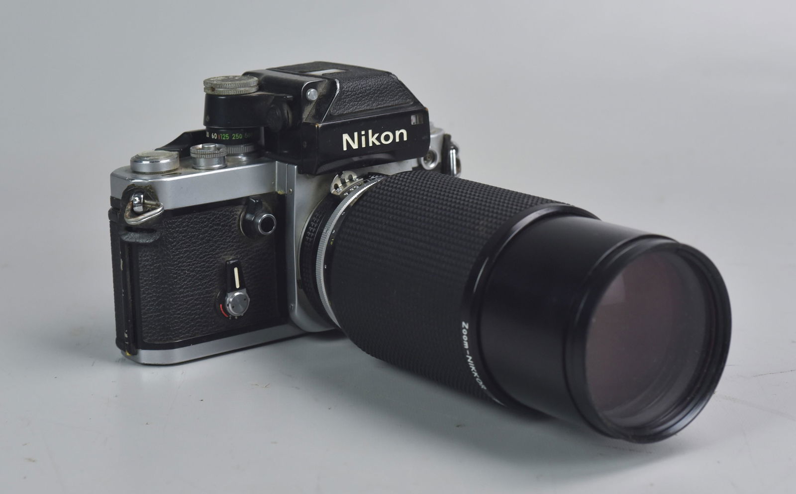 Nikon F2 with 80-200mm zoom lens: Nikon F2 35mm SLR film camera with Zoom-Nikkor 80-200mm 1:4 zoom lens. Both in good condition, shutter fires accurately at low speeds and self timer functions. Some corrosion on the shutter speed adju