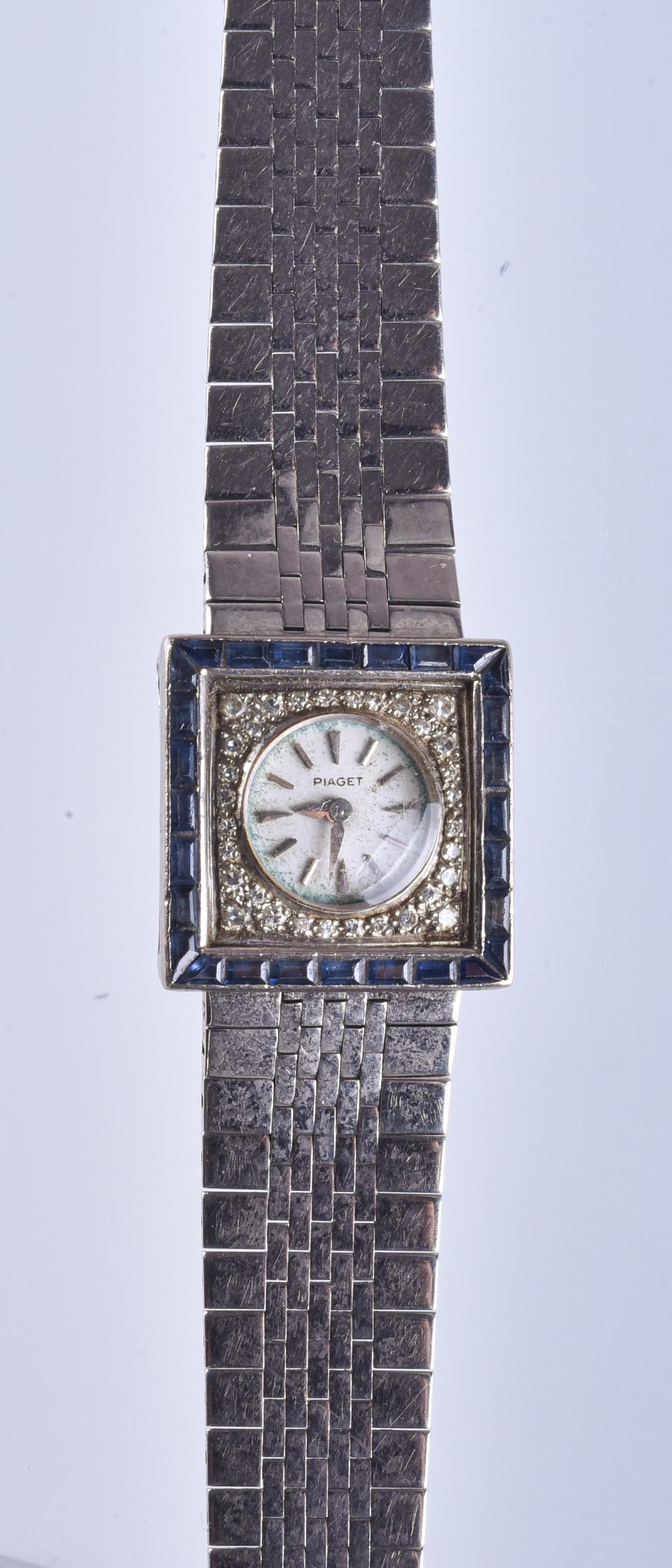 Ladies 18K Gold & Diamond Piaget Watch: Ladies 18K Gold Piaget Watch with 18K Gold Band, Diamond and Blue Sapphire Bezel (31.8 Dwt Total Weight Including Movement)