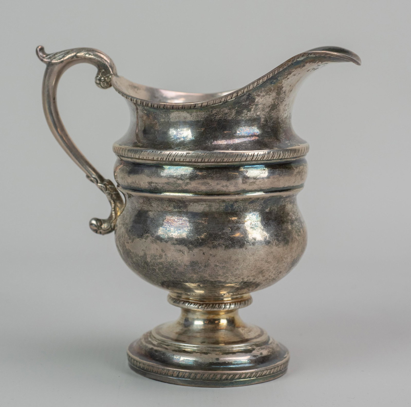 John McMullin, coin silver cream pitcher, PHL: John McMullin, PHL, 1765-1843, coin silver cream pitcher, on a round footed base, c 1820-30, no monogram, 6" h, Hopkinson Collection sticker on base, 9.65 TO : . Provenance: This lot comes from the Ho
