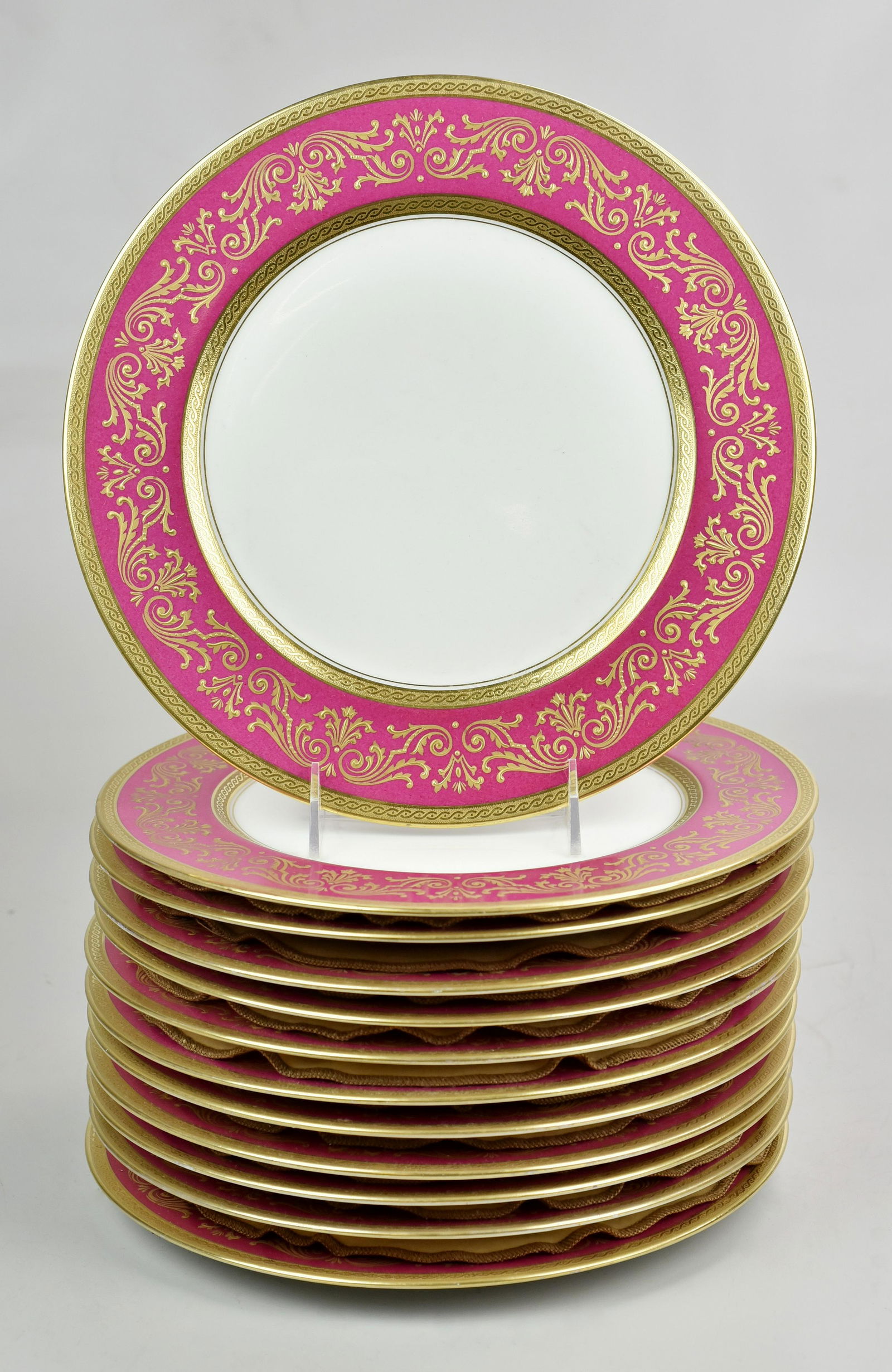 (12) Bernardaud Limoges Dinner Plates: (12) Limoges porcelain dinner plates, pink and gilt border, Marked "B&Co Limoges France L Bernardaud and Co", 10-3/4" dia: . Provenance: This lot comes from the Hopkinson Family Collection, Francis Ho