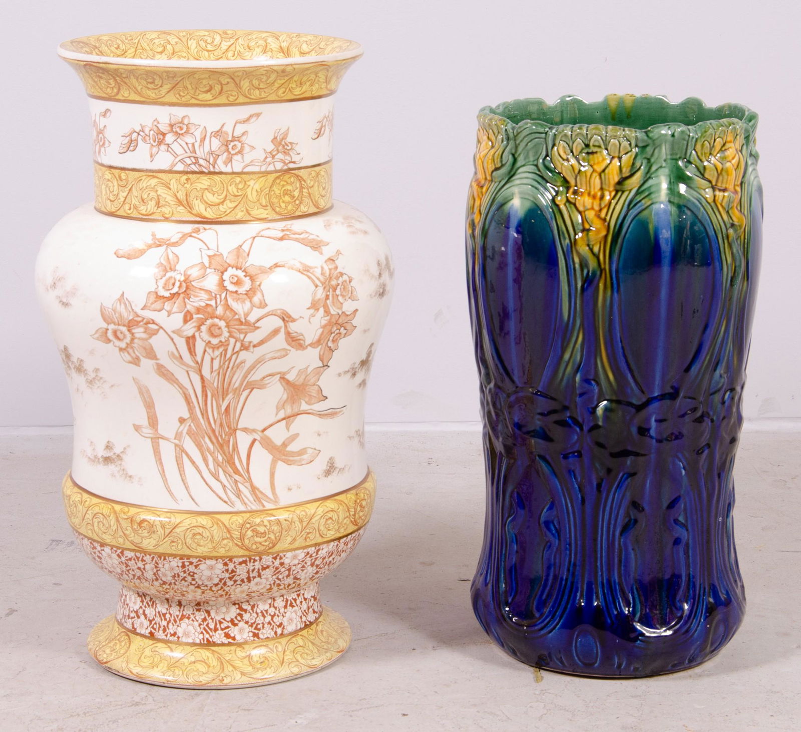 Doulton Burslem Daffodil Umbrella Stand and Other: Doulton Burslem Daffodil umbrella stand and majolica Weller style umbrella stand, 24" and 21"