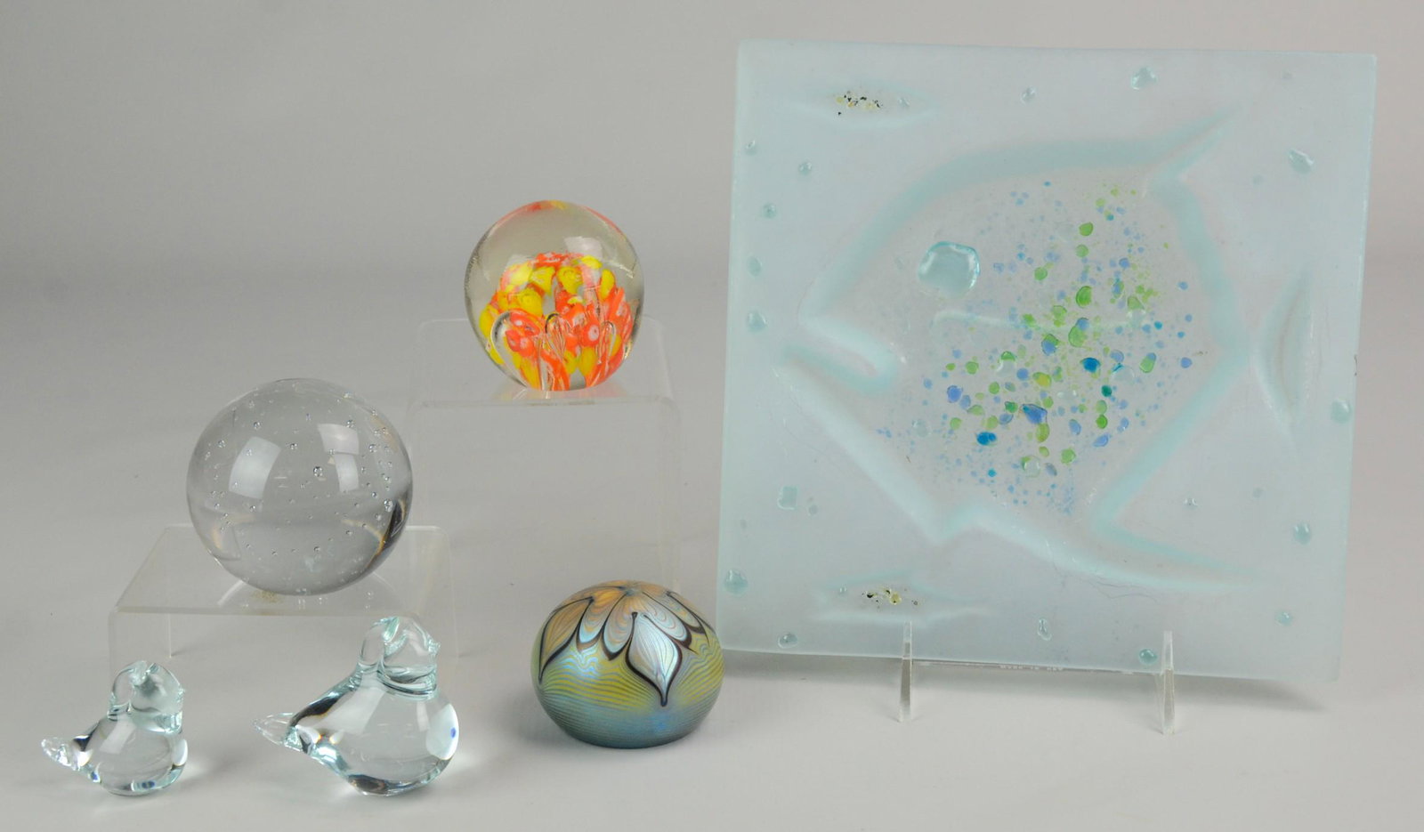 Art Glass Including Paperweights: (3) Paperweights Including: Orient and Flume Iridescent Pulled Feather, Andrea by Sadek Bubble Design, Art Glass Orange and Yellow Paperweight, (2) Glass Birds, Frosted Art Glass Plate with Fish (9" l