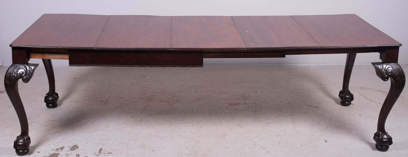 Chippendale style Mahogany dining table: Chippendale style Mahogany dining table, acanthus leaf decoration and knees, ball and claw feet, 30"h x 41"square, three 18-1/2"w boards