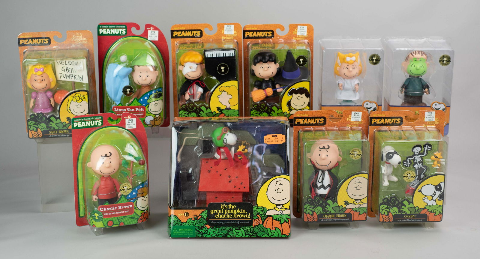 (10) Peanuts Figures In Original Boxes: (10) Peanuts Figures In Original Boxes Including: It's the Great Pumpkin Charlie Brown, Charlie Brown with Hat and Pathetic Tree, Lucy Van Pelt with Black Hat and Witch's Broom, Sally Brown as the Bri