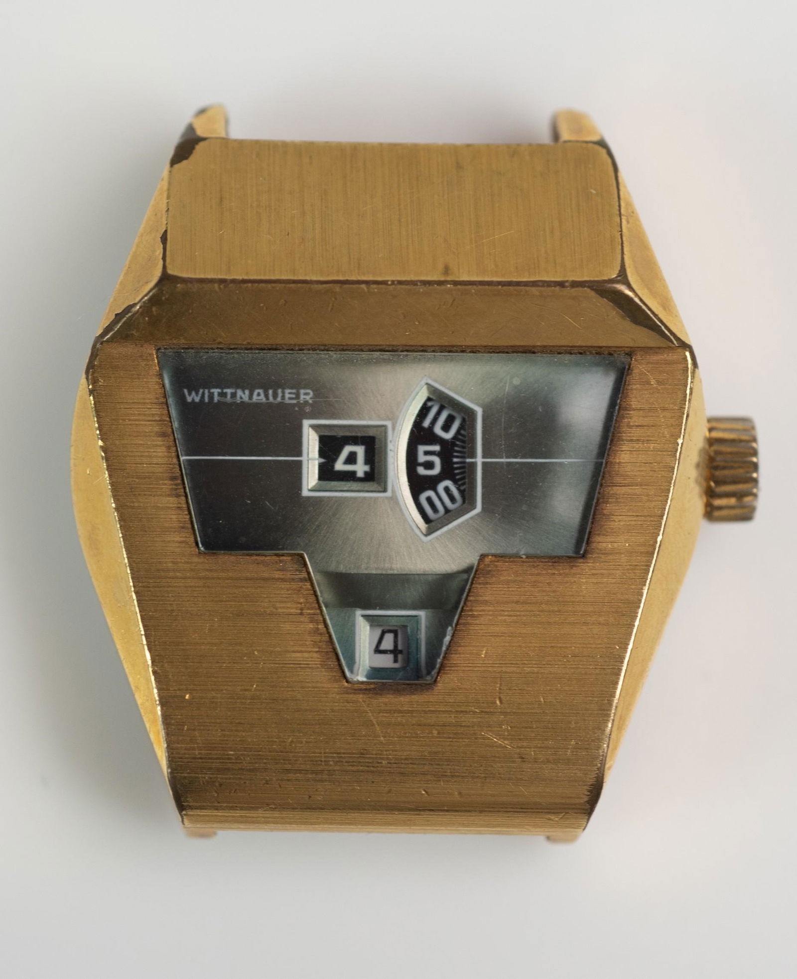 Wittnauer Jump Hour direct read wrist watch: Wittnauer Jump Hour direct read brushed gold tone wrist watch, Tenor-Dorly 1393 calibre automatic wind movement, does not seem to run, c 1970's.