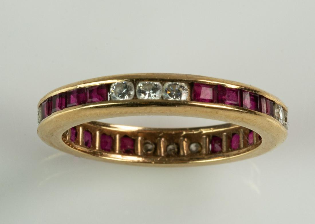 Unmarked 14K YG diamond & ruby eternity band: Unmarked 14K YG diamond & ruby eternity band, 4 groups of 3 round diamonds separated by 4 groups of 3 ruby baguettes, all channel set, stones about 2 mm, size 5,