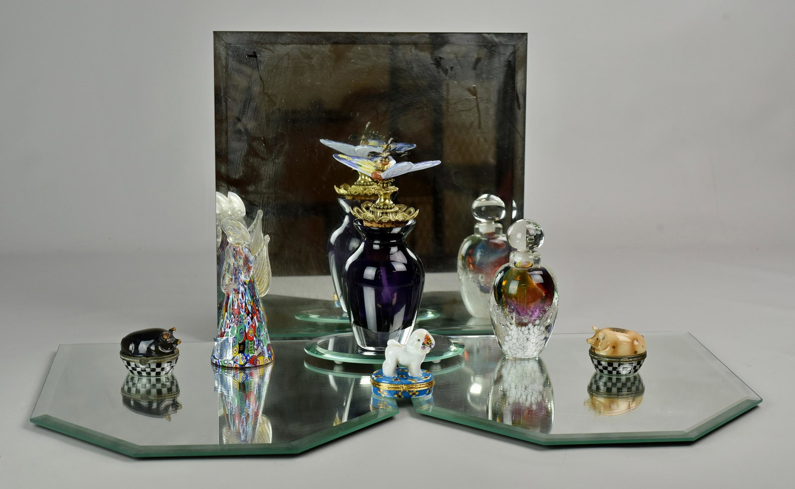 Mirrored Plateau, Art Glass Perfumes, Boxes: 3-Pc beveled mirror plateau, cased glass perfume with porcelain butterfly finial, art glass perfume, Murano glass angel, Artoria Limoges dog with butterfly trinket box, 2 Jam Bon pig trinket boxes