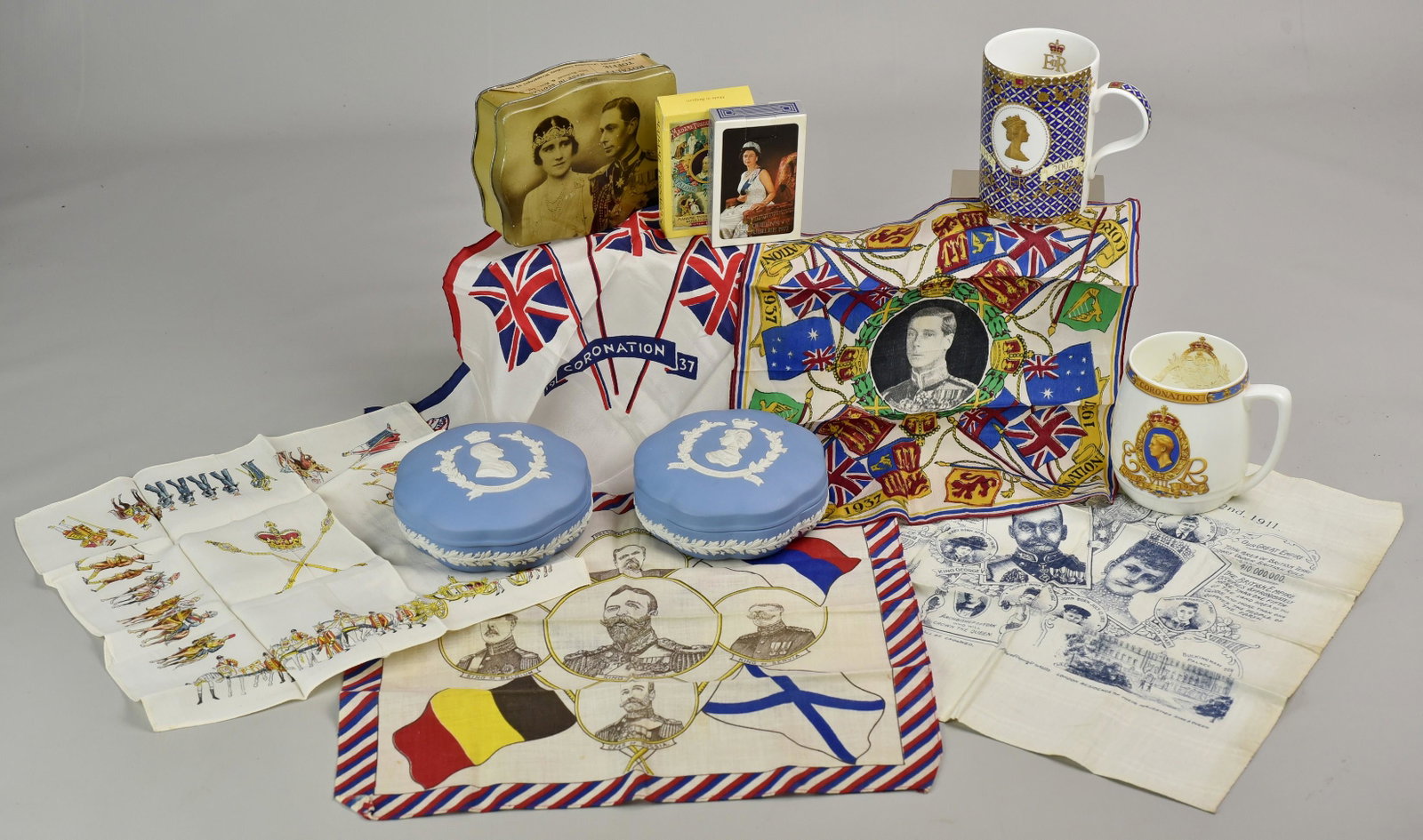 Lot of British Royalty Memorabilia: Lot of British Royalty memorabilia, c/o 2 Wedgwood dresser boxes (Queen Elizabeth & Duke of Edinburgh June 1953), King George VI & Queen tin box, Madame Tussaud's Exhibition playing cards, Queen's Sil