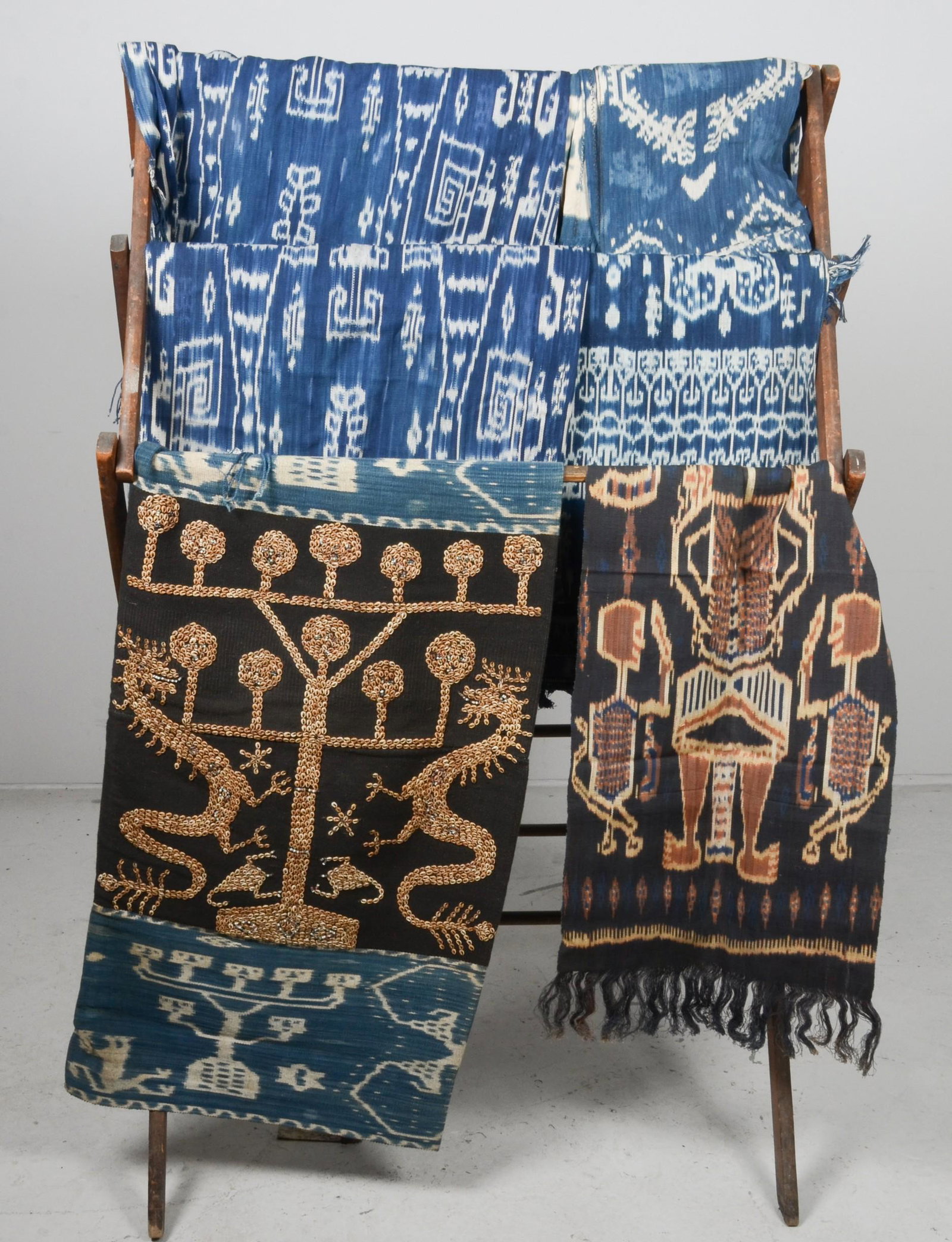 (6) Sumba Ikat Hingii: (6) Indonesian East Sumba ikat hingii, several with fringe edge, one with large shell scene at center. Comprised of blue, white and black,