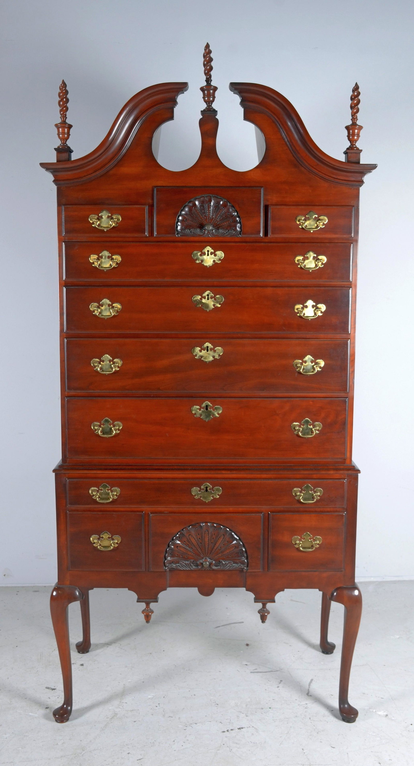 Statton QA style highboy: Statton QA style highboy, Oldtowne finish, flame finials, shell decoration on two drawers, 84"h x 38"w x 19-1/2"d, split in side of lower portion
