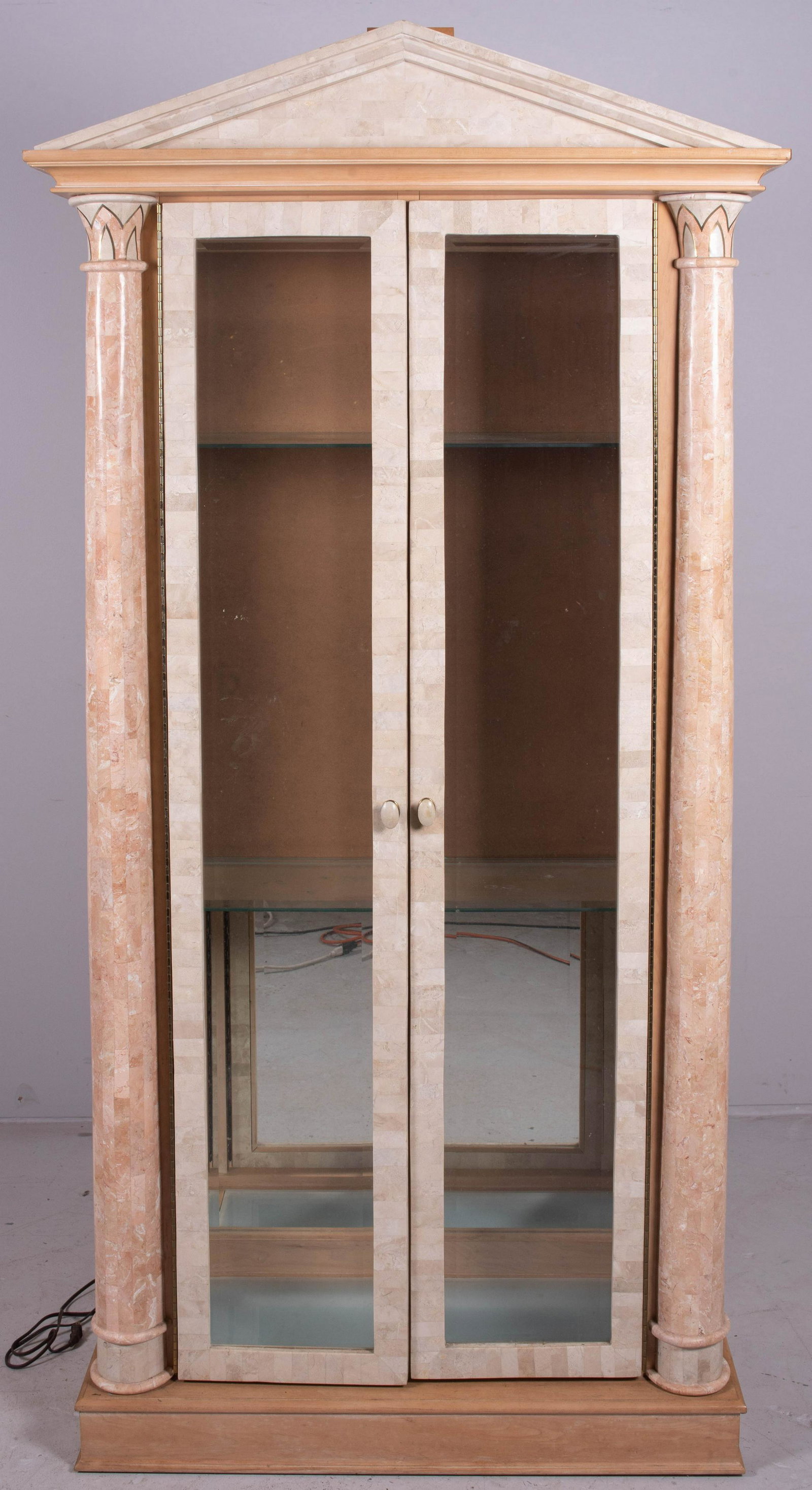 Modern Design tessellated display cabinet: Modern Design tessellated display cabinet, two beveled glass doors, mirrored back, glass shelves, lighted interior, 85" h x 42" w x 17" d, damage to mirrored back, and damaged tessellated pcs
