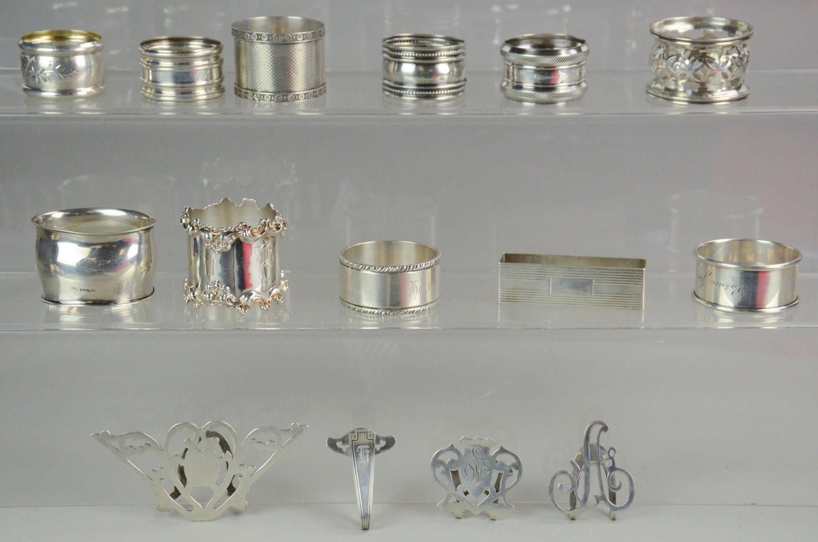 (15) Sterling Napkin Rings and Holders: (15) Sterling napkin rings and holders including Webster, R. Blackinton and Co. of MA, Lenox Silver of NY, Gorham, Apollo. 8 T.O