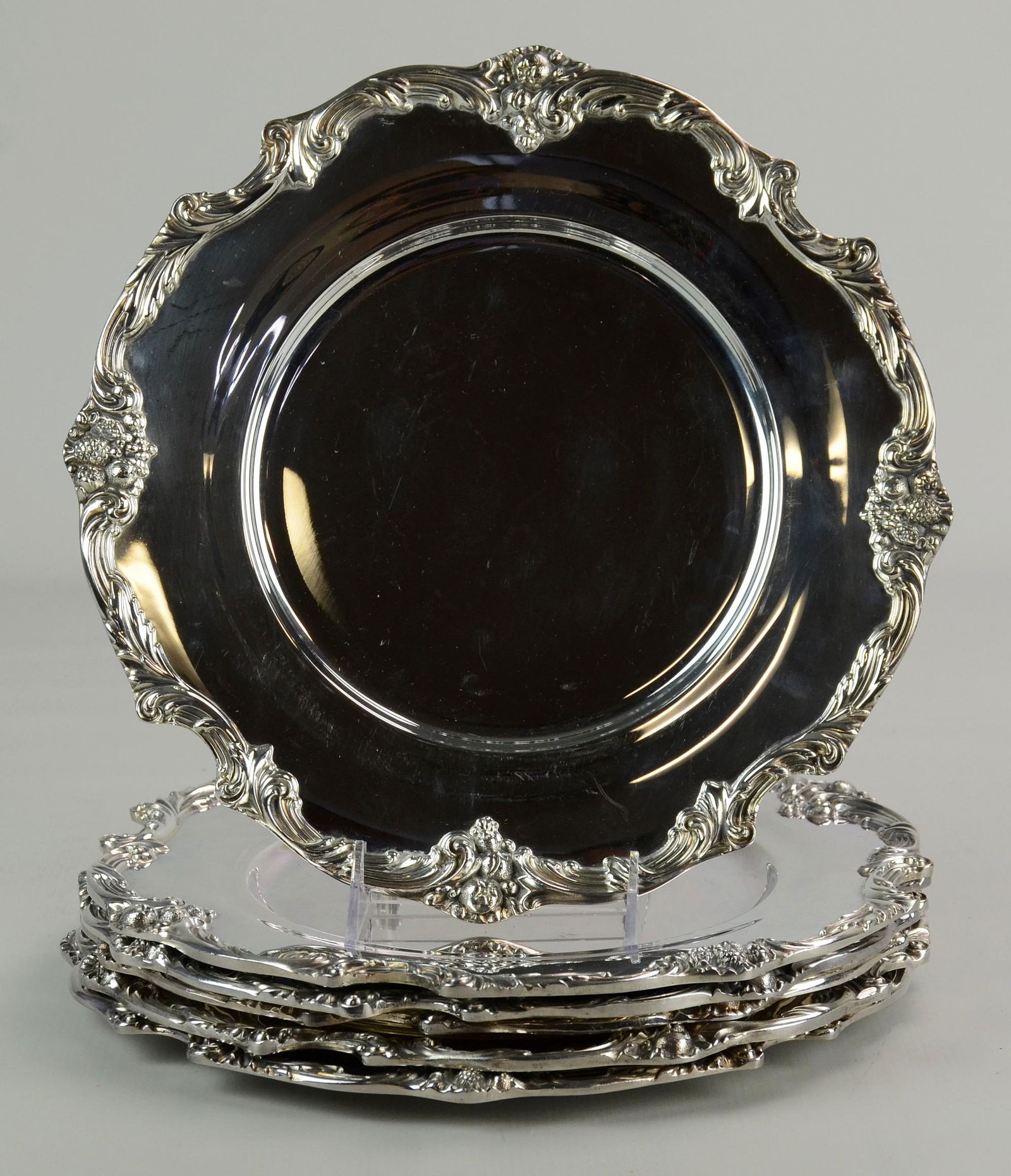 (6) Reed and Barton Plate King Francis Chargers: (6) Reed and Barton plate King Francis chargers. C-scroll surround with fruit bouquets, 11-1/2" diam.