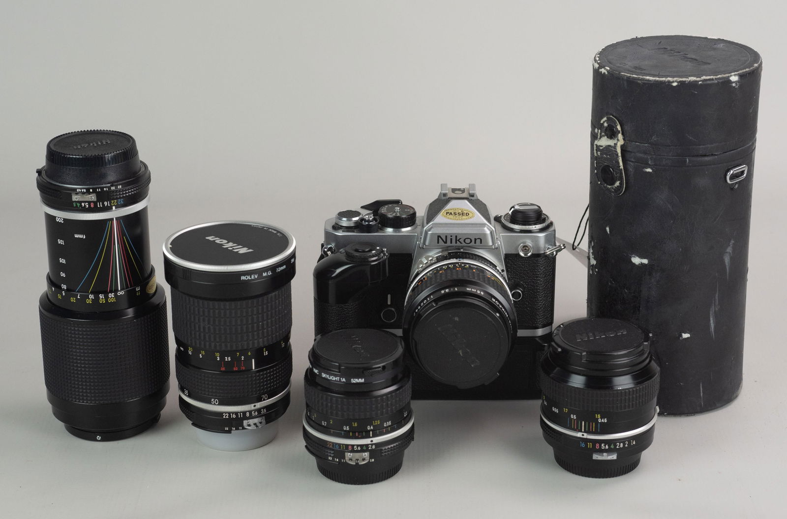 Nikon FE Camera and Lenses (5): Nikon FE 35mm SLR camera with MD12 motordrive, Micro-Nikkor 55mm 1:3.5, Zoom-Nikkor 35-70mm 1:3.5, Nikkor 50mm 1:1.4 non-Ai, Nikkor 24mm 1:2.8, and Zoom Nikkor 80-200mm 1:4.5 w/ case. Camera not batte