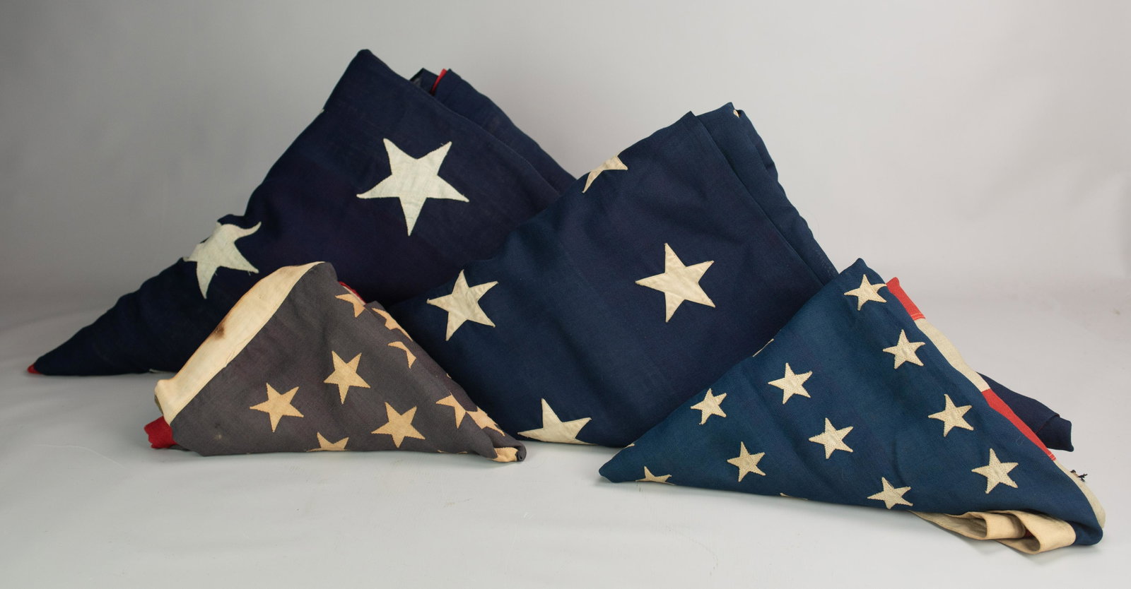 (4) 45-Star American Flags 1896-1908: (4) 45-star American flags commemorating Utah statehood, 1896-1908. All machine sewn, wool bunting and cotton stars, 170"x96", 69"x35", 66-1/2"x44" and 88"x57"