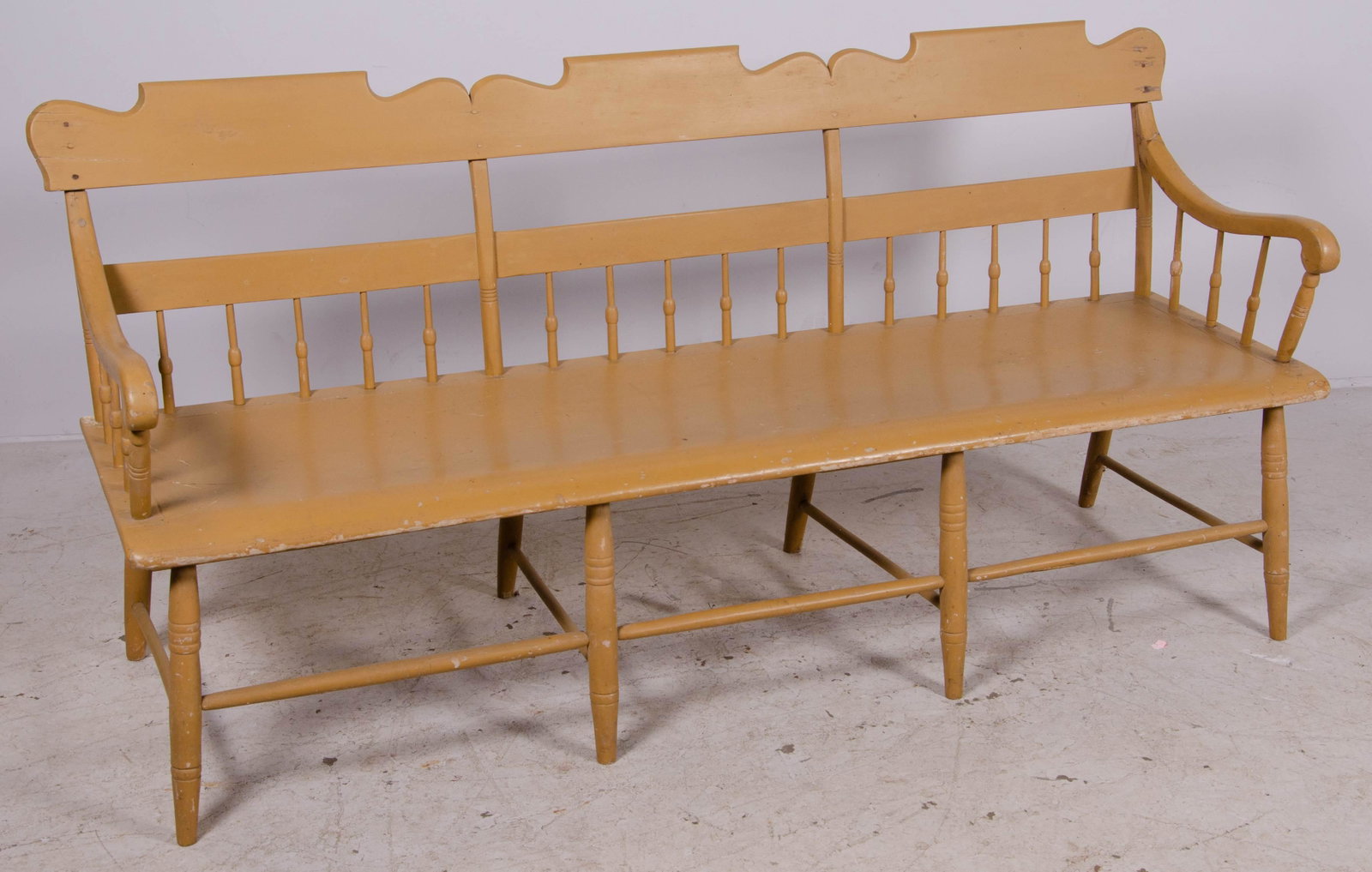 Painted half spindle plank seat settee, mid 19th c: Painted half spindle plank seat settee, yellow/beige painted, mid 19th c, 35"h x 71"w x 33"d