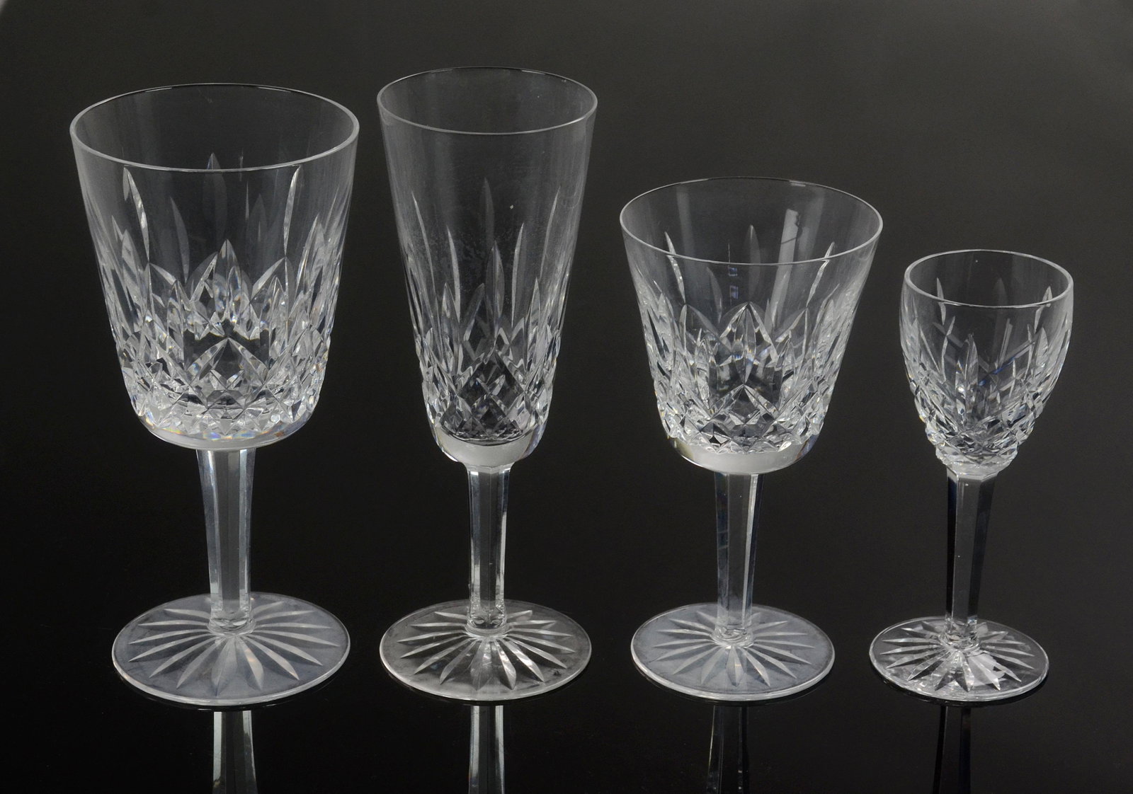 (25) Waterford 'Lismore' Cut Crystal Glasses: (25) Waterford 'Lismore' cut crystal glasses c/o (5) fluted champagnes, (7) water goblets, (9) claret wines and (4) cordials.