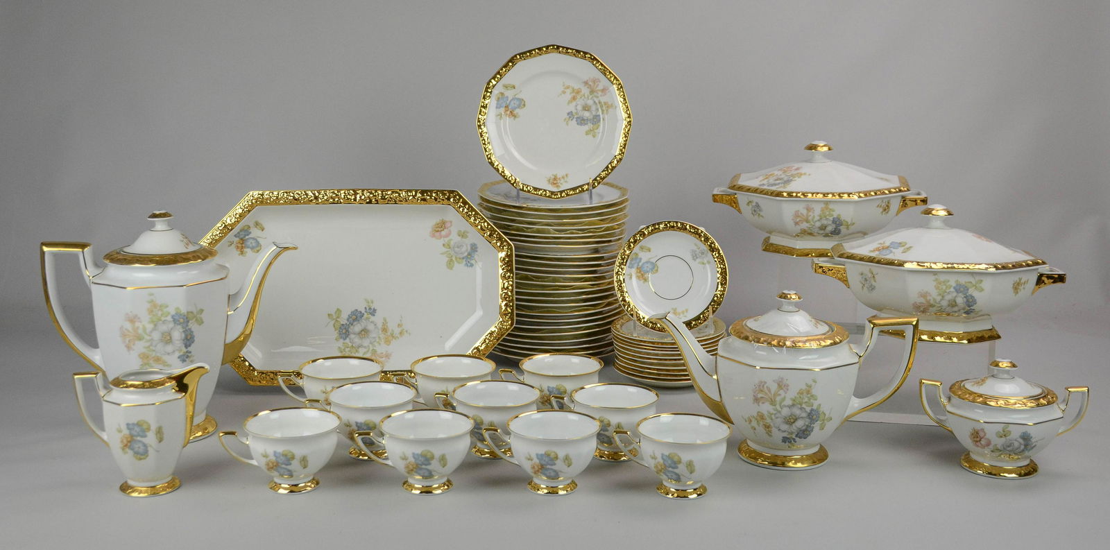 (52) Pcs Rosenthal Maria Dinnerware: (52) Pcs Rosenthal porcelain dinnerware, Maria floral pattern, gold encrusted border, US Zone Germany, c/o 24 dessert plates, 10 teacups, 11 saucers, cut corner rectangular platter, 2 covered casserol