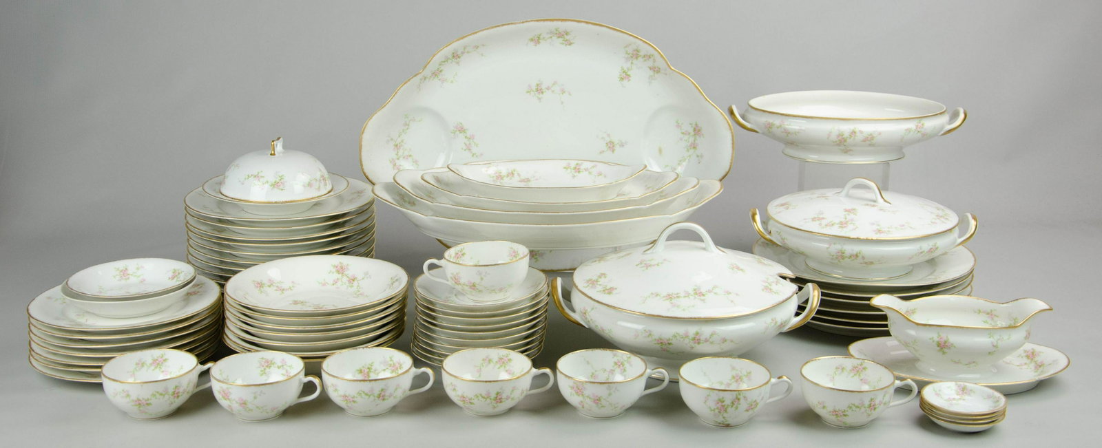 (66) Pcs Theodore Haviland Pink Floral Dinnerware: (66) Pcs Theodore Haviland porcelain pink floral dinnerware, gold border, c/o 6 dinner plates, 12 luncheon plates, 7 salad plates, 2 fruit bowls (one similar Limoges, not matching), 7 soup bowls, 8 te