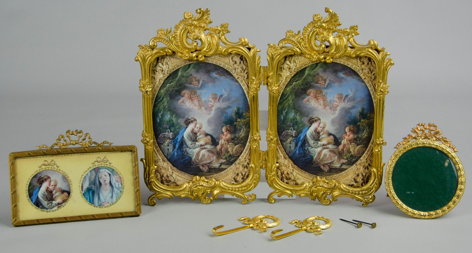 Ormolu and Brass Picture Frames: Ormolu and brass picture frames c/o Royal M Mfg. Co double sided Nouveau style gilt metal frame, French double portrait frame with celluloid matte and bow form ormolu at top, 5"x4", round French gilt 