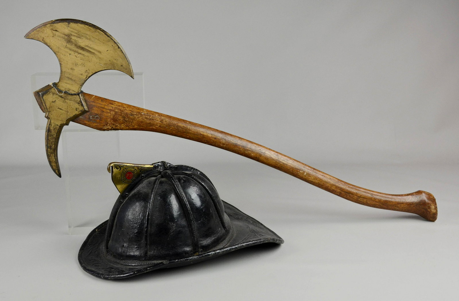 Fireman Helmet & Axe: Fireman helmet & axe, helmet with tag inside "Cairns & Brother Mfrs of Fireman's Equipment & Supplies Clifton New Jersey", hatchet 34" l