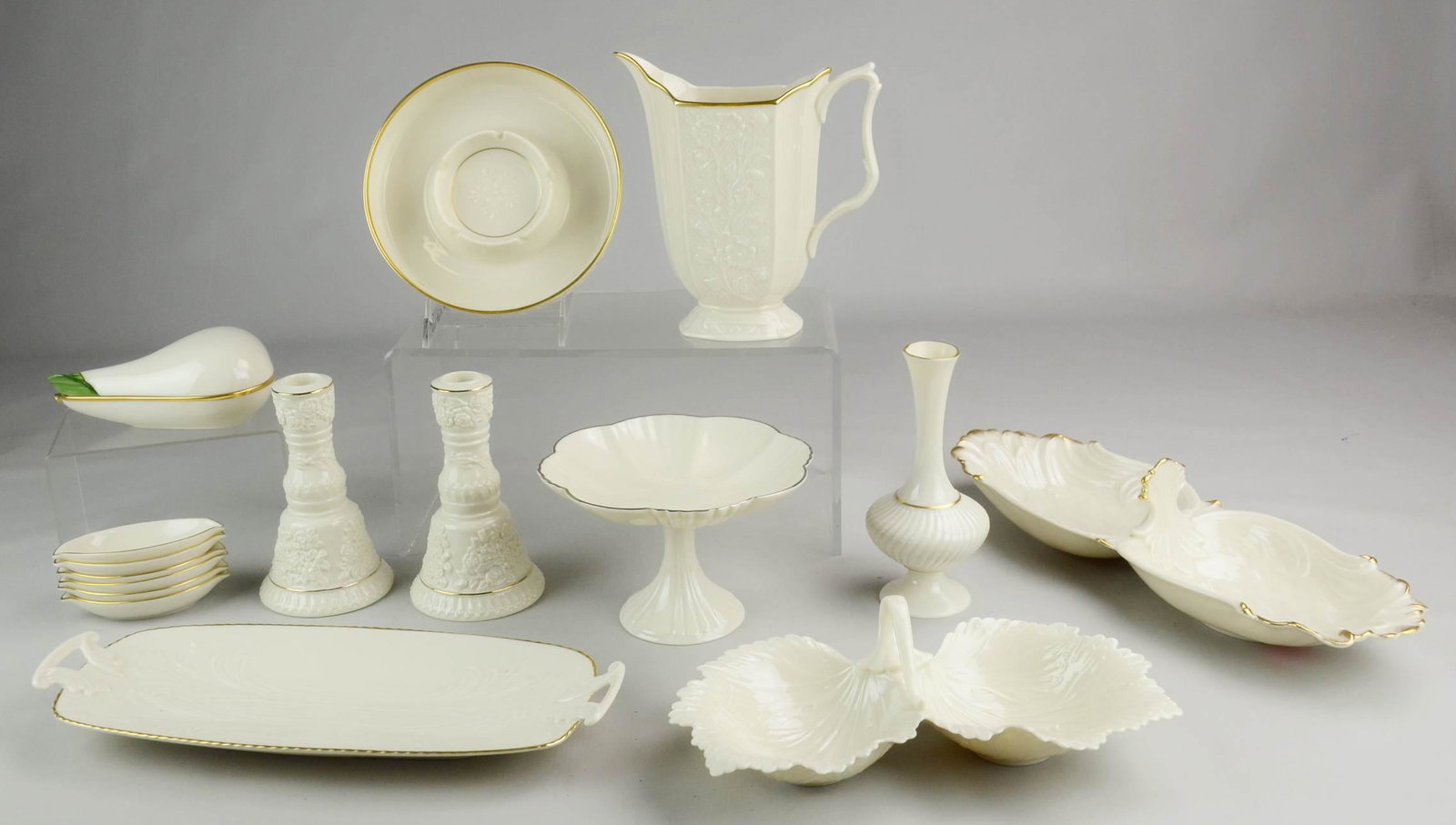 (16) Pcs Lenox: (16) Pcs Lenox c/o silver rim compote, gadrooned vase, floral decorated pitcher, covered pear form trinket box, double handled tray, (6) nut dishes, oversized ashtray, (2) double sided dishes and (1) 