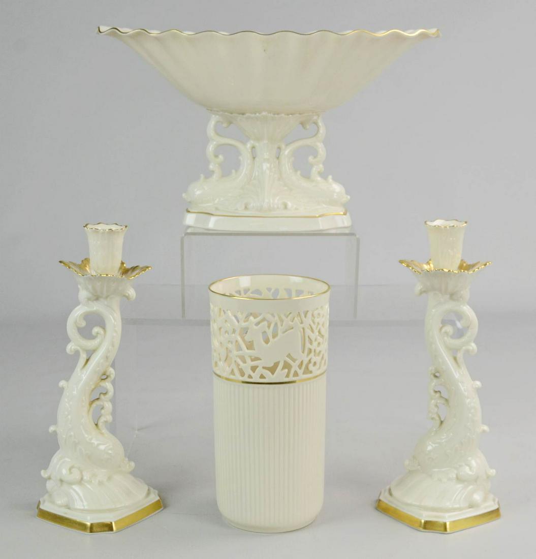 (4) Lenox Porcelain Pieces: (4) Lenox porcelain pieces c/o dolphin decorated shell form footed compote with gilt highlight, 6-3/4" h 12" l, pr dolphin form candlesticks with gilt edge, 10" and pierced rabbit, deer and small anim