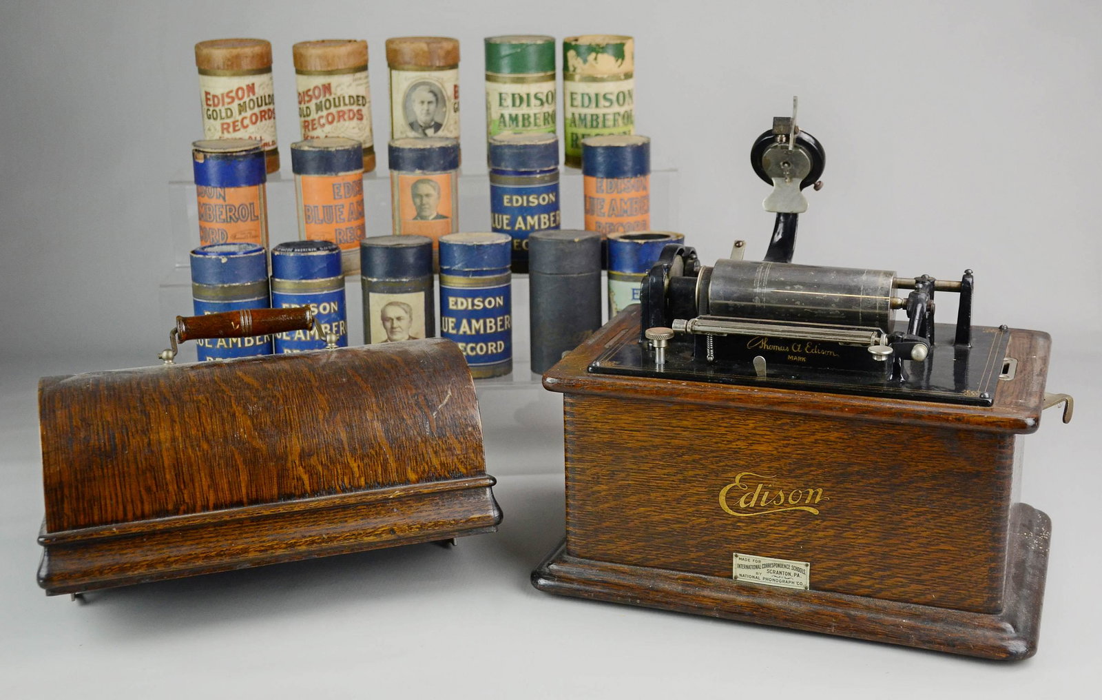 National Phonograph Co Edison Phonograph: National Phonograph Co Edison phonograph, missing bell, made for International Correspondence Schools Scranton PA, 13" x 9-1/2" x 11-1/2" h, with 16 Edison Amberol records (one broken)