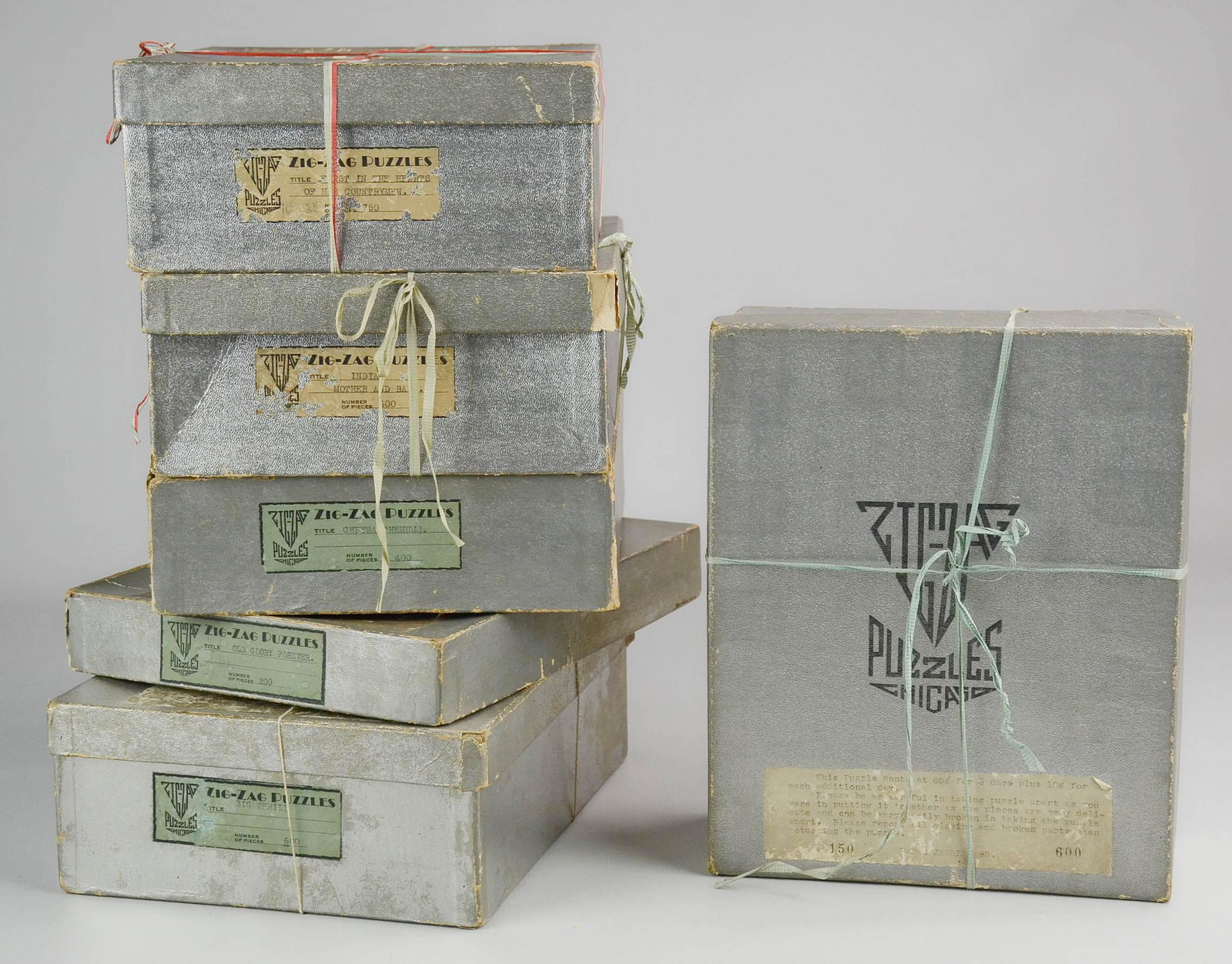 (6) 1930's Zig-Zag of Chicago Puzzles: (6) 1930's Zig-Zag of Chicago puzzles c/o (6) wooden puzzles titled A Beautiful Moment, Old Glory Forever, Big Thrill, First In The Hearts of His Countrymen, Indian Mother and Babe and Chrysanthemums.