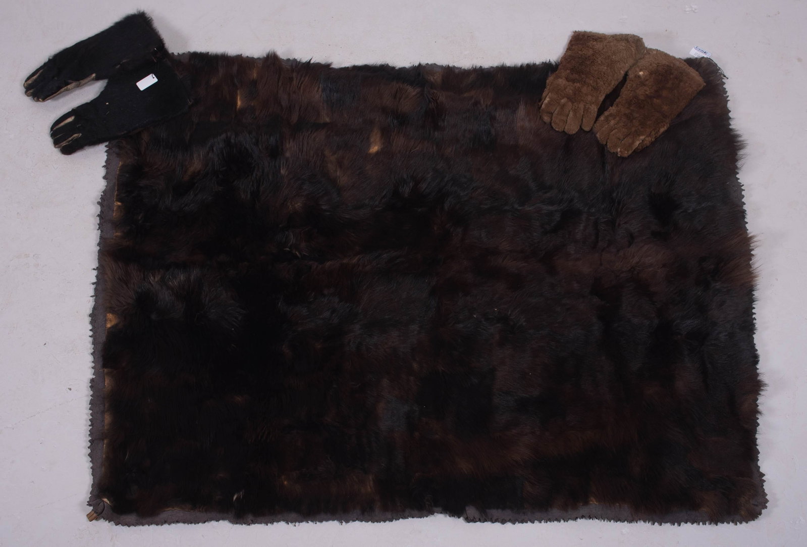 J.H Bishop Co. Antique Bear Throw and Gloves: J.H Bishop Co. antique bear throw and gloves c/o throw made on the banks of the Detroit River in the 1880's, felt backed, 60"x50". Includes (1) pr bear skin gloves and sheared beaver gloves, maker unk