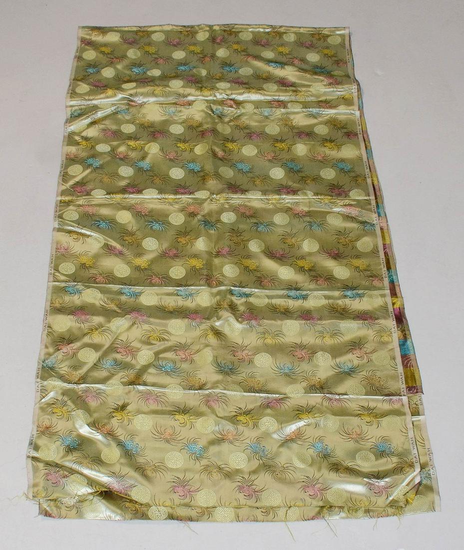 Silk Jacquard Yardage: Silk jacquard yardage c/o pistachio green ground with floral and good luck symbol decoration, approx 5 yards