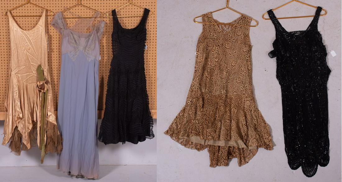 (5) Antique Dresses: (5) Antique dresses c/o gold lace late 1910's shift, black sequined 20's shift, (1) 1930's silk drop waist dress with velvet floral decoration, (1) 40's lavender evening dress in poor condition and (1