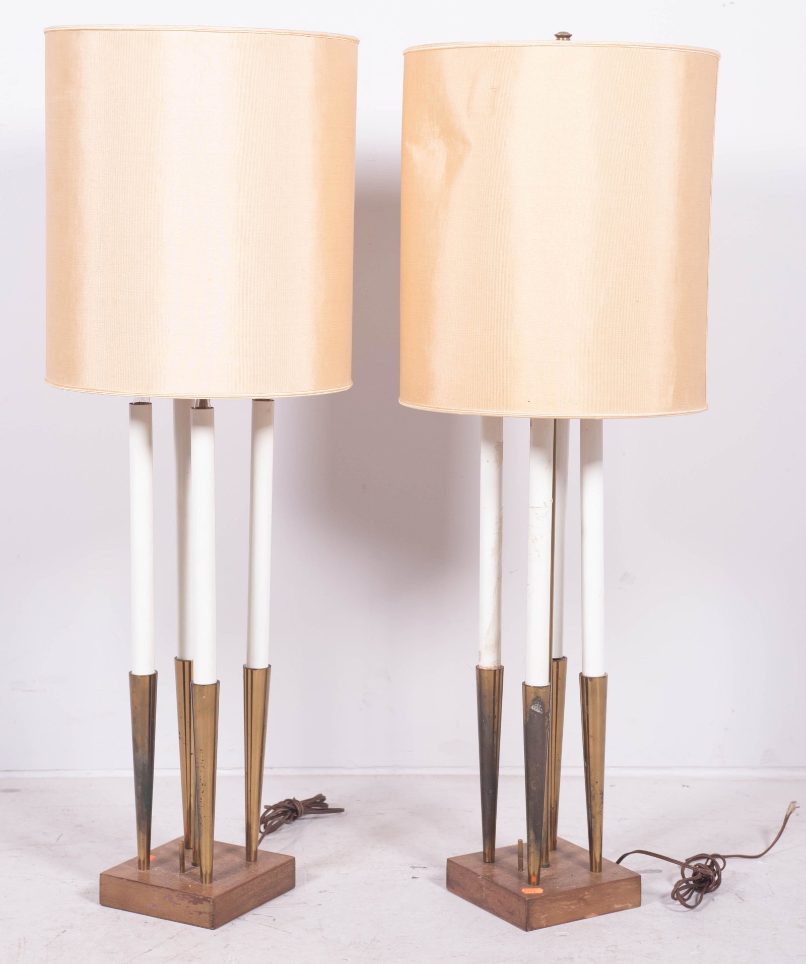 Pair Tommi Parzinger style brass and walnut table lamps: Pair Tommi Parzinger style brass and walnut table lamps, 42-1/4" h, wear to base, soiling to shades