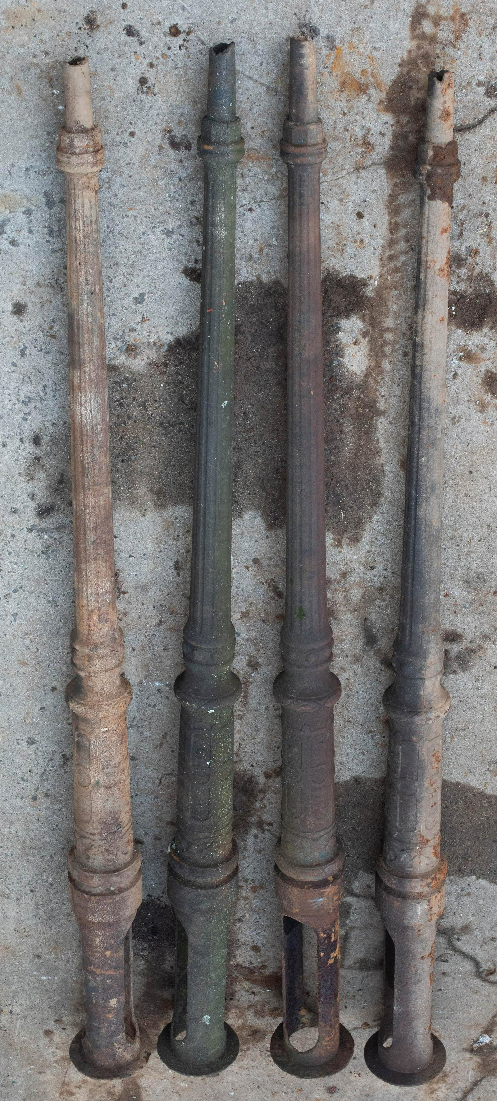 (4) fluted post cast iron light poles, 19th c, 136" h: (4) fluted post cast iron light poles, top section of column with a tapered fluted design, lower part round with recessed panel design, 136" overall length, effective length when installed 101" to sho