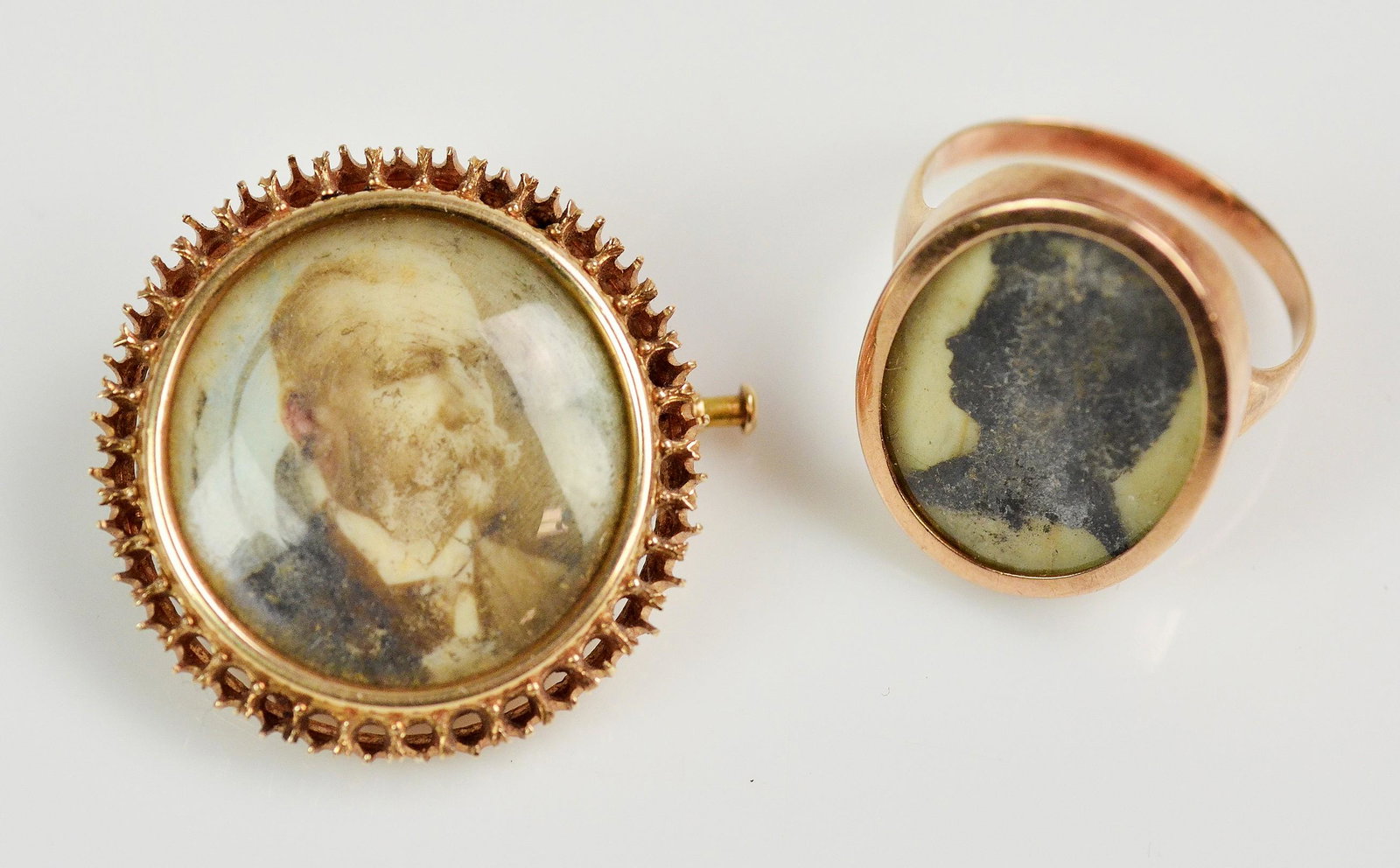 (2) 14K Yellow Gold Mourning Jewelry Group: (2) 14K Yellow Gold Pieces of Victorian Mourning Jewelry C/O; (1) 14K Round Brooch Pin picture locket, it is missing the gemstones or possibly seed pearls that surround the picture, (1) Momento Mori S