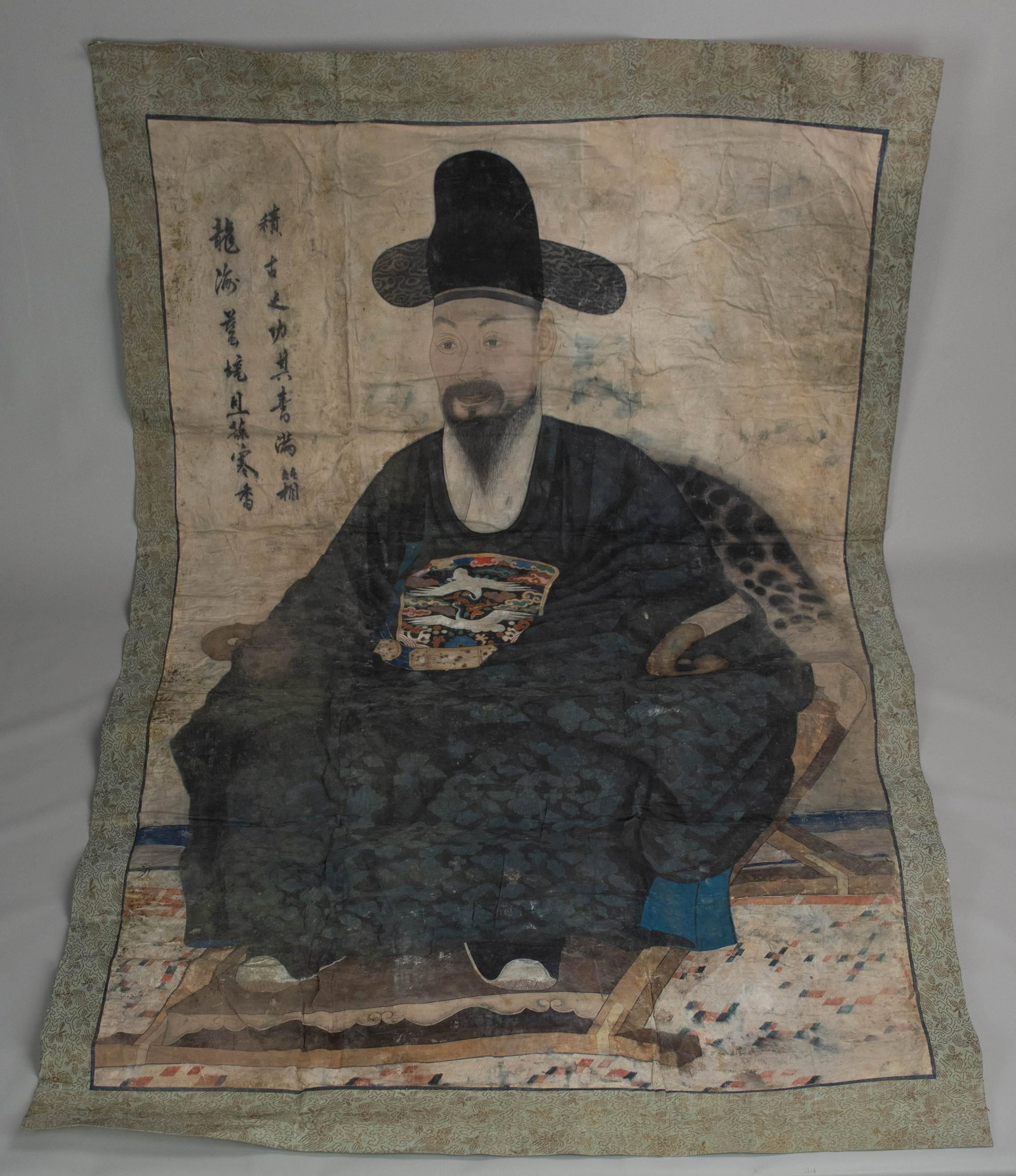 Korean ancestor portrait w/rank badge: Korean ancestor portrait w/rank badge and calligraphy to front and obverse, 55" x 34-1/2", Acquired from a local home, no historical information. No visible tears or repairs, areas of flaking paint mo