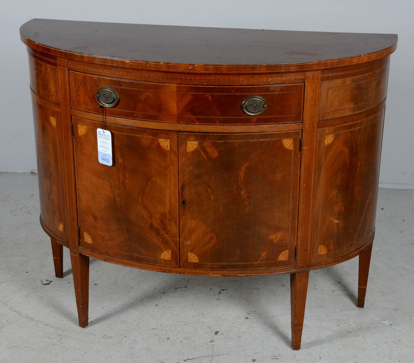 Hepplewhite style inlaid demilune commode: Hepplewhite style inlaid demilune commode, one drawer over two doors, 36-1/4" h x 45" w x 16" d