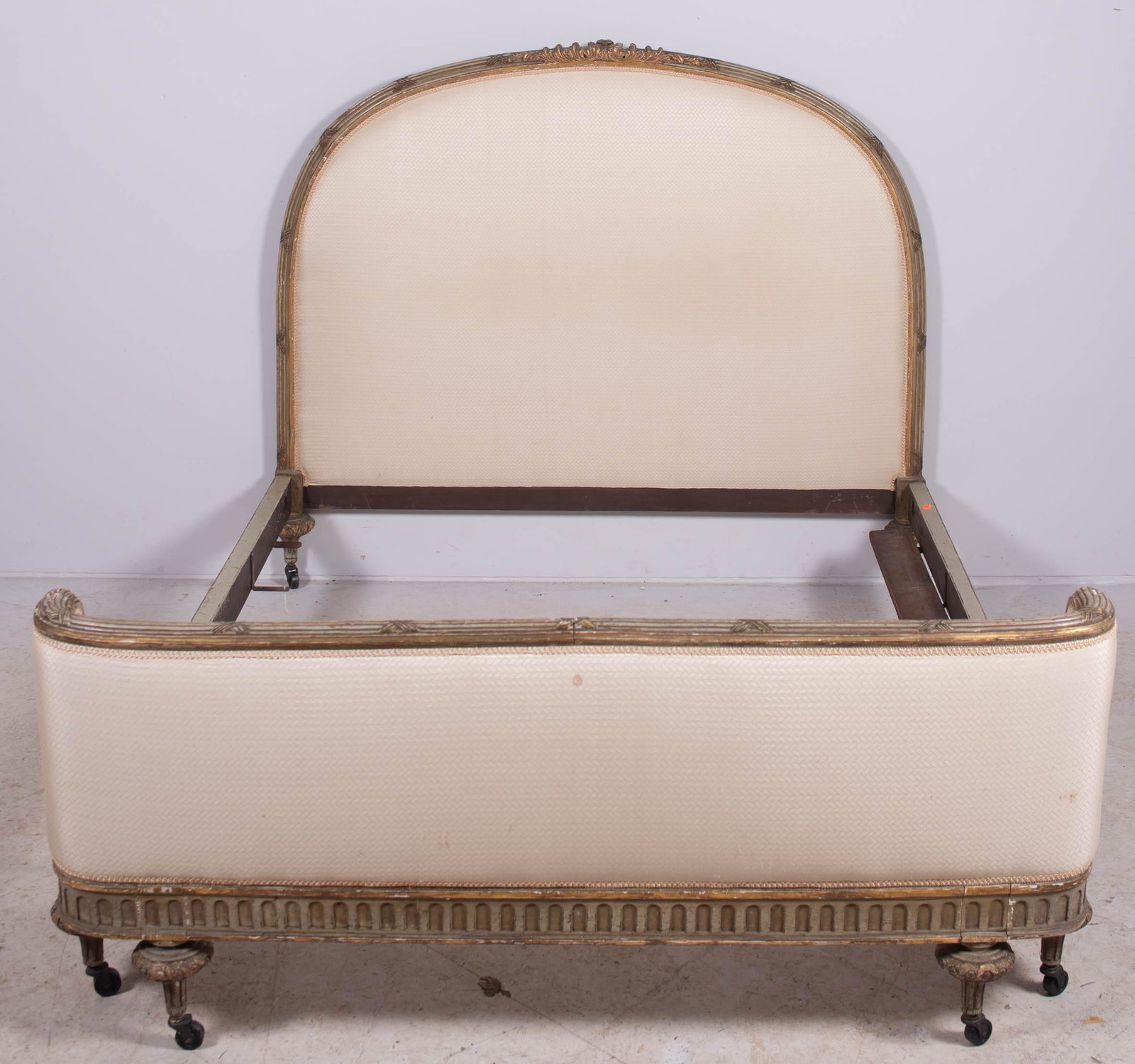 French style gilt painted & upholstered full size bed: French style gilt painted & upholstered full size bed, cream decorative upholstery on headboard and footboard, headboard 52" h x 57" w