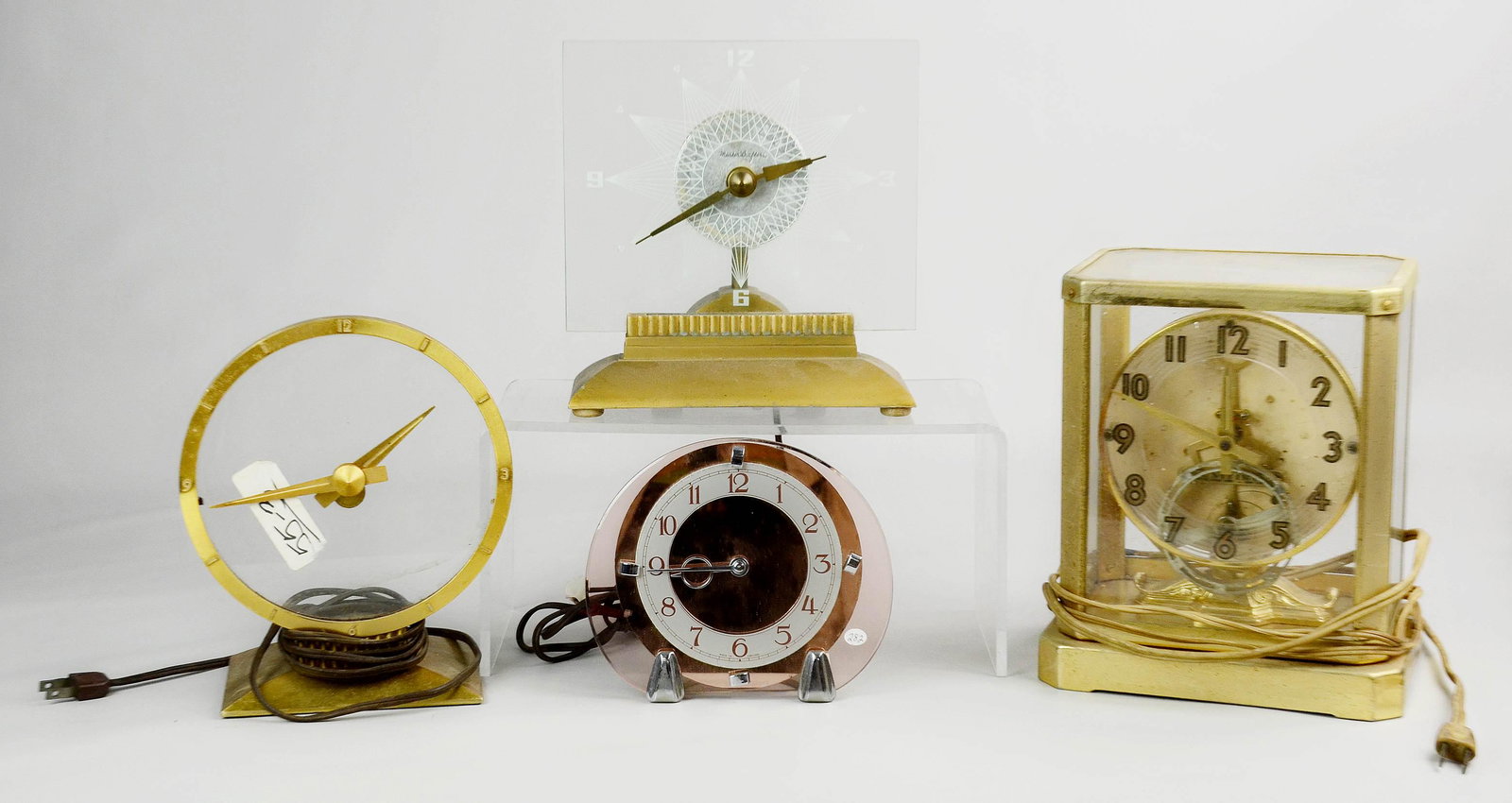(4) Glass Electric Clocks: (4) Glass electric clocks, including Atmos style, Mastercrafters, Smiths English Clocks, Jefferson Golden Hour, tallest 9-3/4"