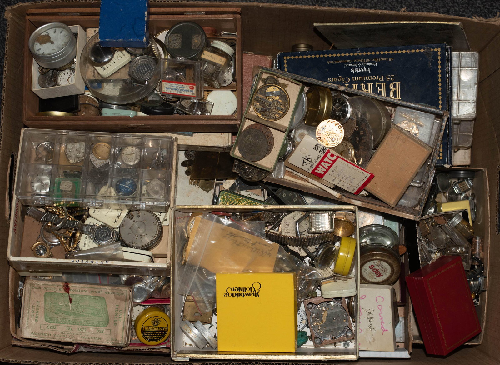 Large Lot of Wristwatch Parts: Large lot of wristwatch parts, including faces, gears, cases, etc.