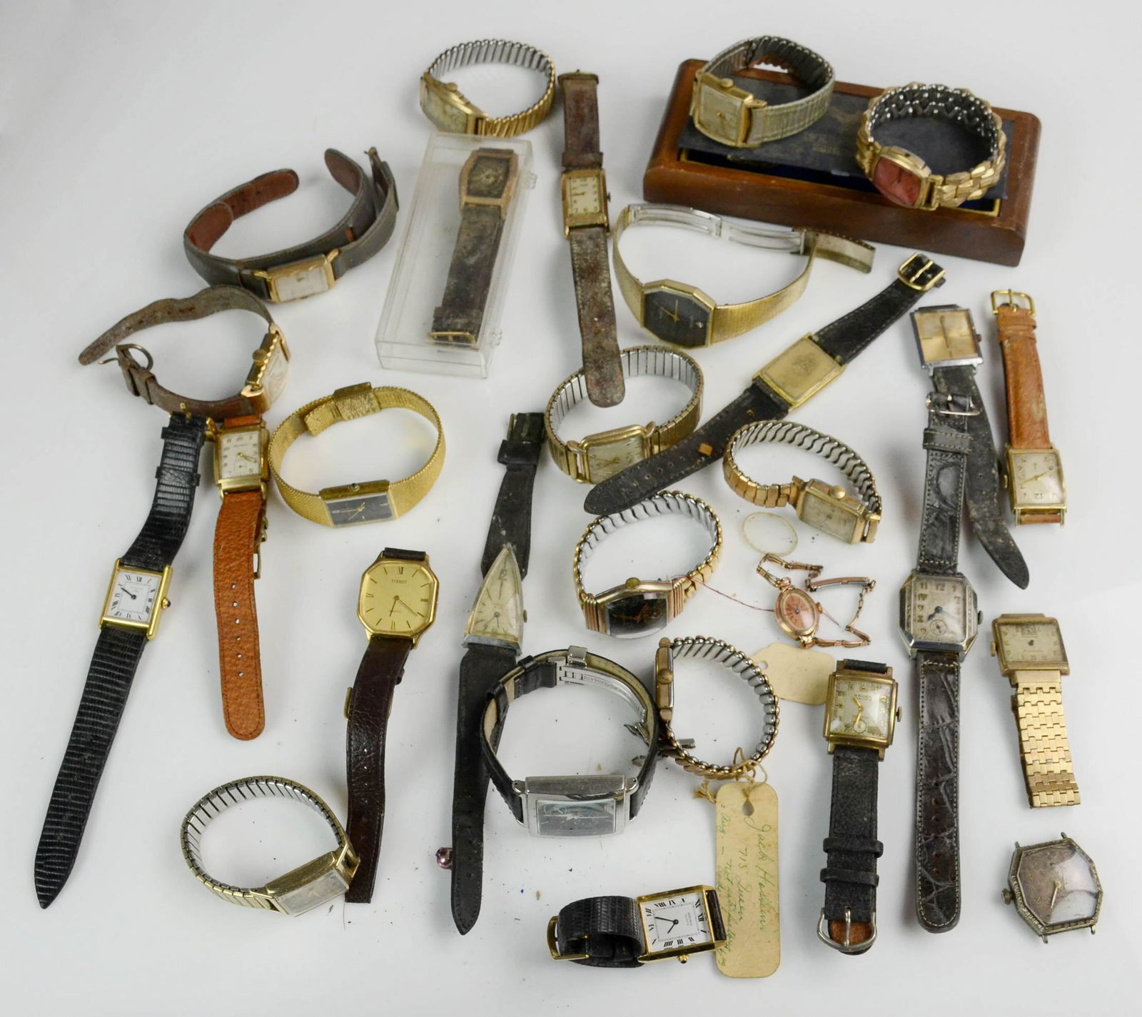 Large lot of Mens Vintage Tank Watches: Large lot of Mens Vintage tank wrist watches Gruen, Elgin, Hamilton and others one Elgin is in a vintage case. For parts, repair or restoration. 2.4 Lbs.