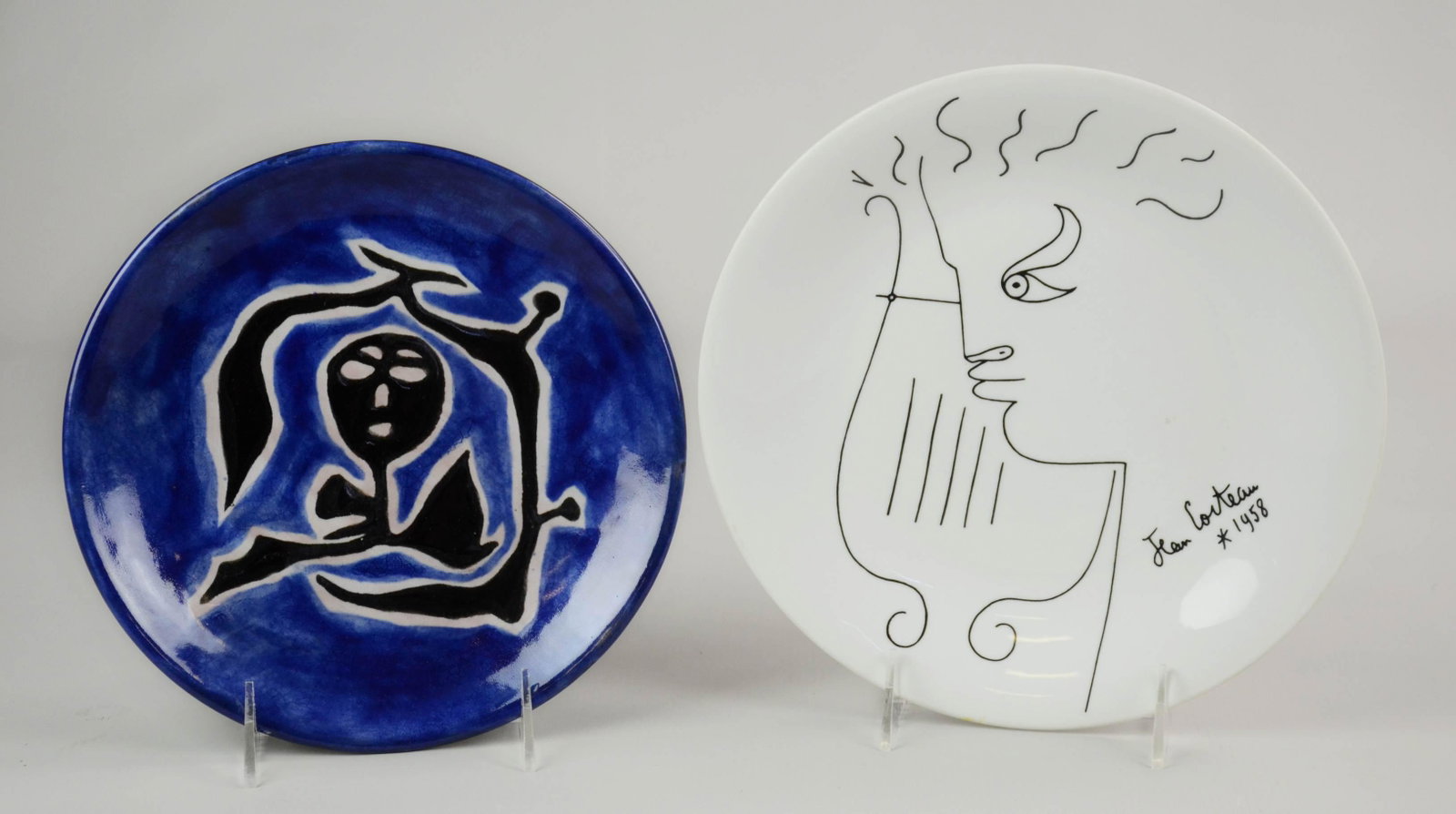Jean Cocteau and Jean Lurcat Plates: Jean Cocteau and Jean Lurcat plates c/o Cocteau for Limoges harp player plate, dated 1958, 9-1/4" and Jean Lurcat plate with hand painted modernist scene at center, signed by the artist on underside, 