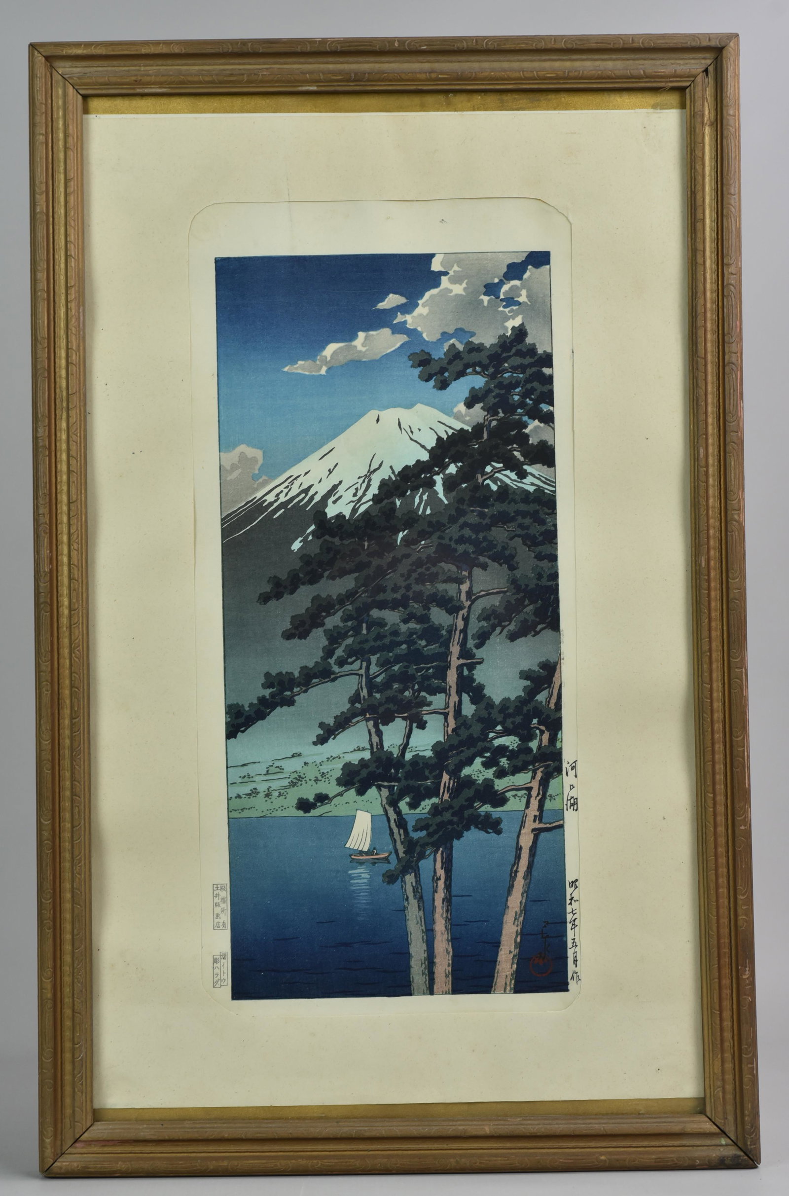 Kawase Hasui Wodoblock Print " Lake Kawaguchi": Kawase Hasui (Japanese, 1883-1957) wood block print " Lake Kawaguchi", red seal lower right, stamps in margin, 14-1/4" x 6-1/2" image, framed size 21-3/4" x 13-3/4", good condition, not inspected out 
