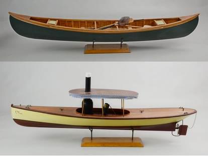 (2) Model Boats in Stand: (2) Model boats in stand c/o wood painted canoe on stand with oars and implements, 31-1/2" and wood painted covered boat with brass ties and cotton awning surround, 30", both on stand.