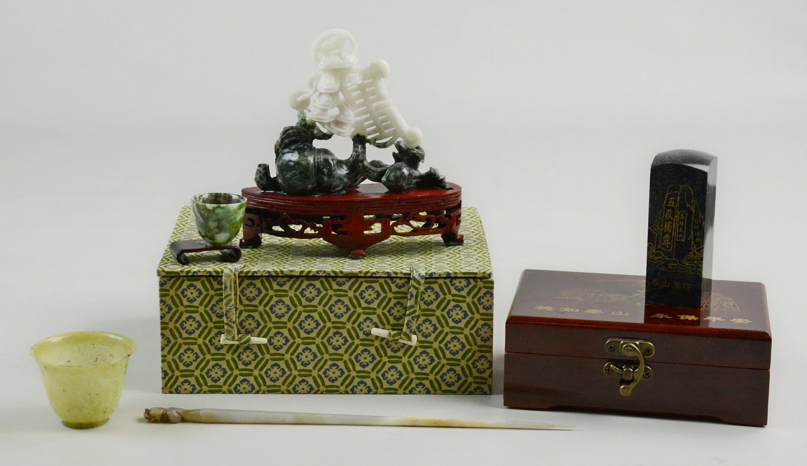 (5) Chinese Carved Stone Pieces: (5) Chinese carved stone pieces, c/o 2 spinach cups, black & white carving symbolizing long life, wealth & happiness, paperweight with calligraphy, hair pick, longest 10"