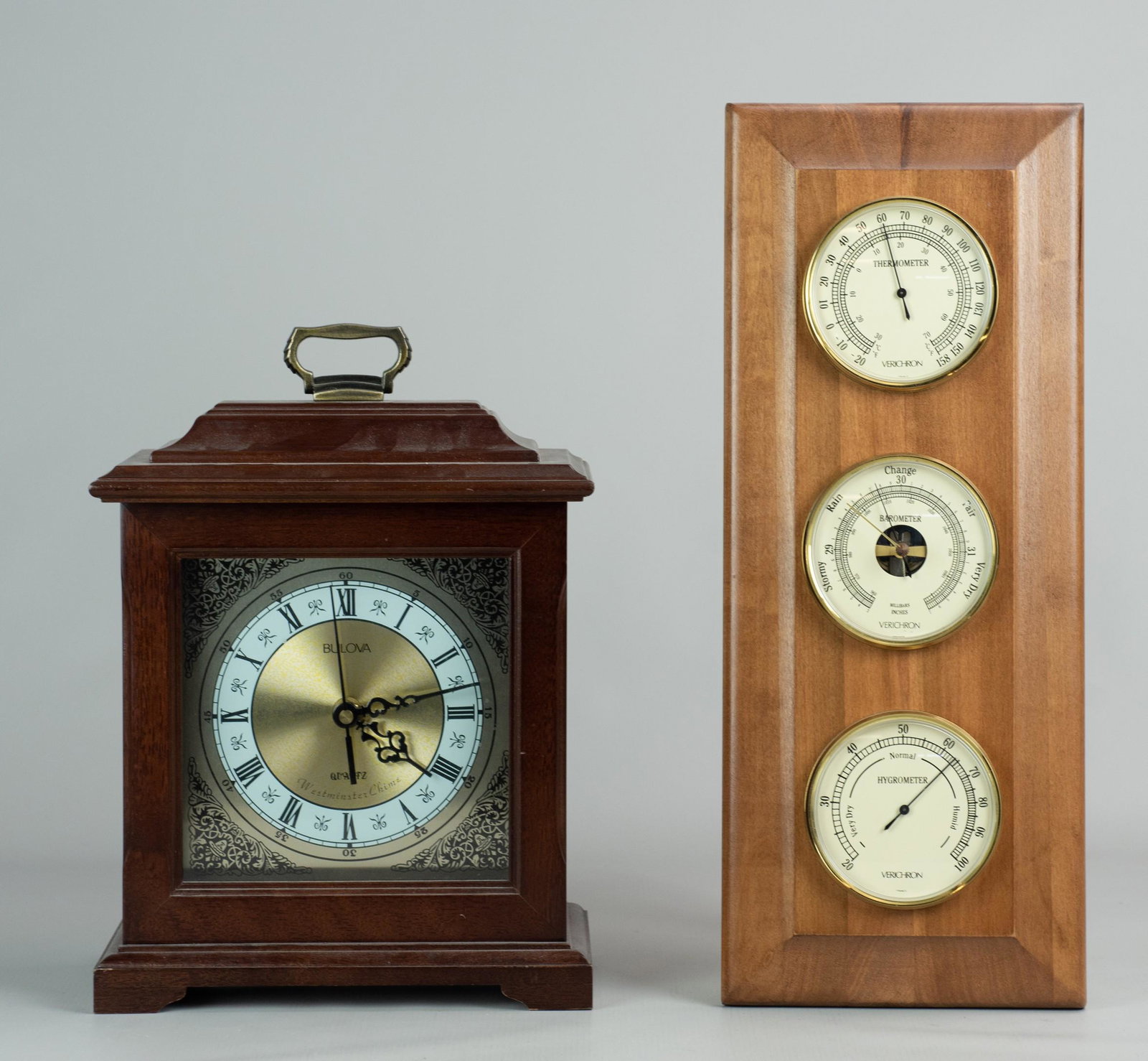 Bulova Shelf Clock & Verichron Thermometer: Bulova quartz Westminster chime shelf clock (12" h excluding handle), and Verichron Thermometer/Barometer/Hygrometer, both in working condition, 17-3/4" x 7"