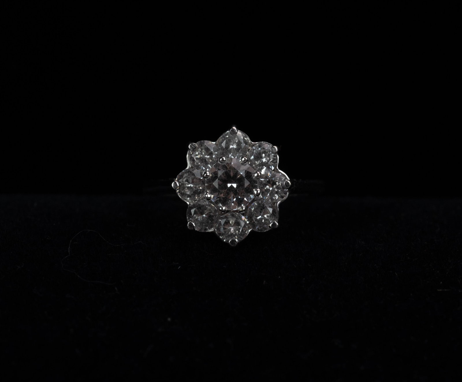10K White Gold Ring with Flower Shape Clear Stones: 10K White Gold ring with Flower Shape Clear stones 1.78 Dwt. (marked 14K, testing at 10K) sz. 6