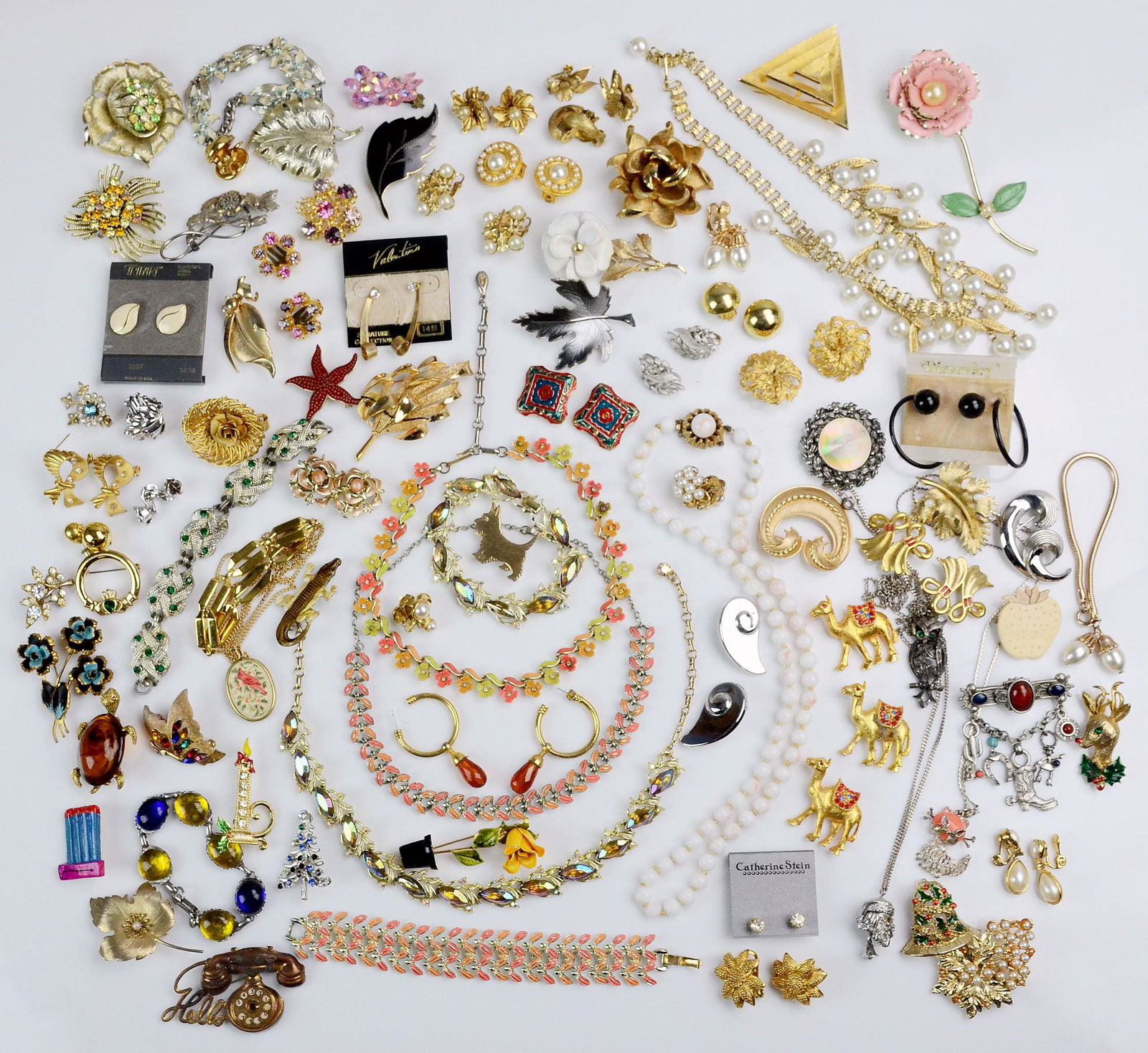 A collection of 1950's Costume Jewelry: A collection of 1950's Style Costume Jewelry C/O; Pins, Brooches, Bracelets , Earrings, some signed pieces, like park lane, coro, Trifari, corocraft, Marvella, and Avon.